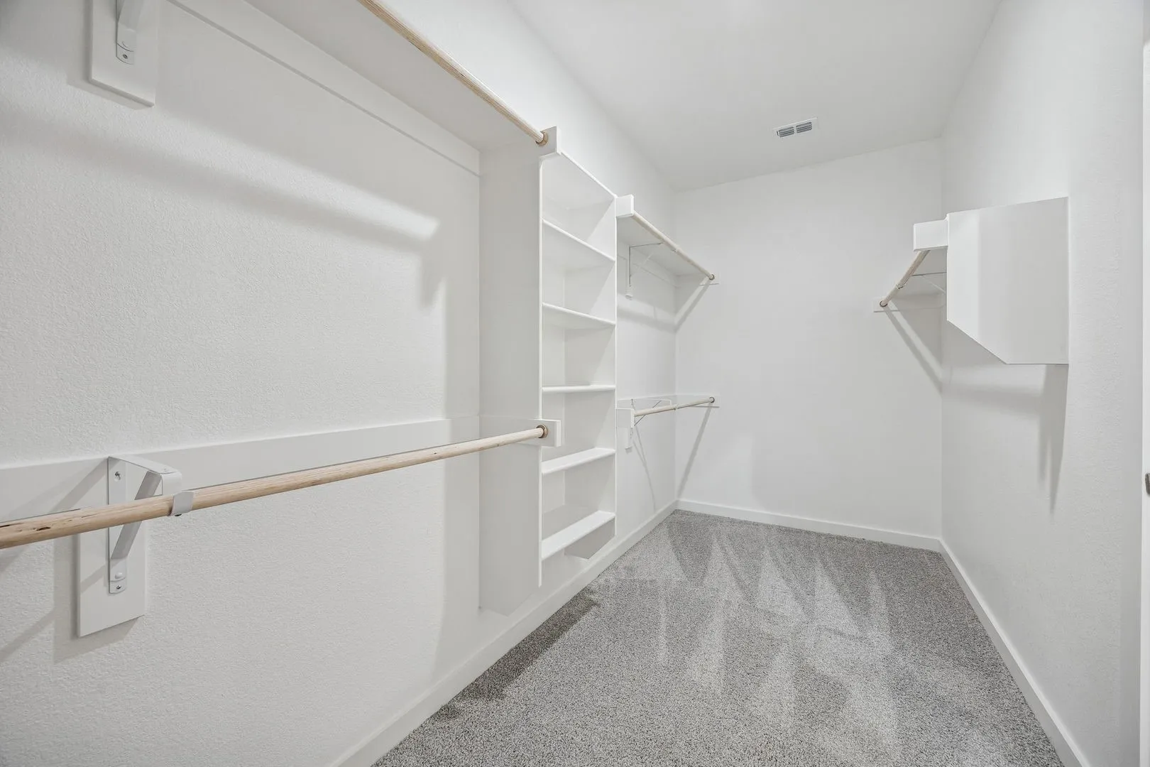 Primary Closet in the Heisman home plan by Trophy Signature Homes – REPRESENTATIVE PHOTO