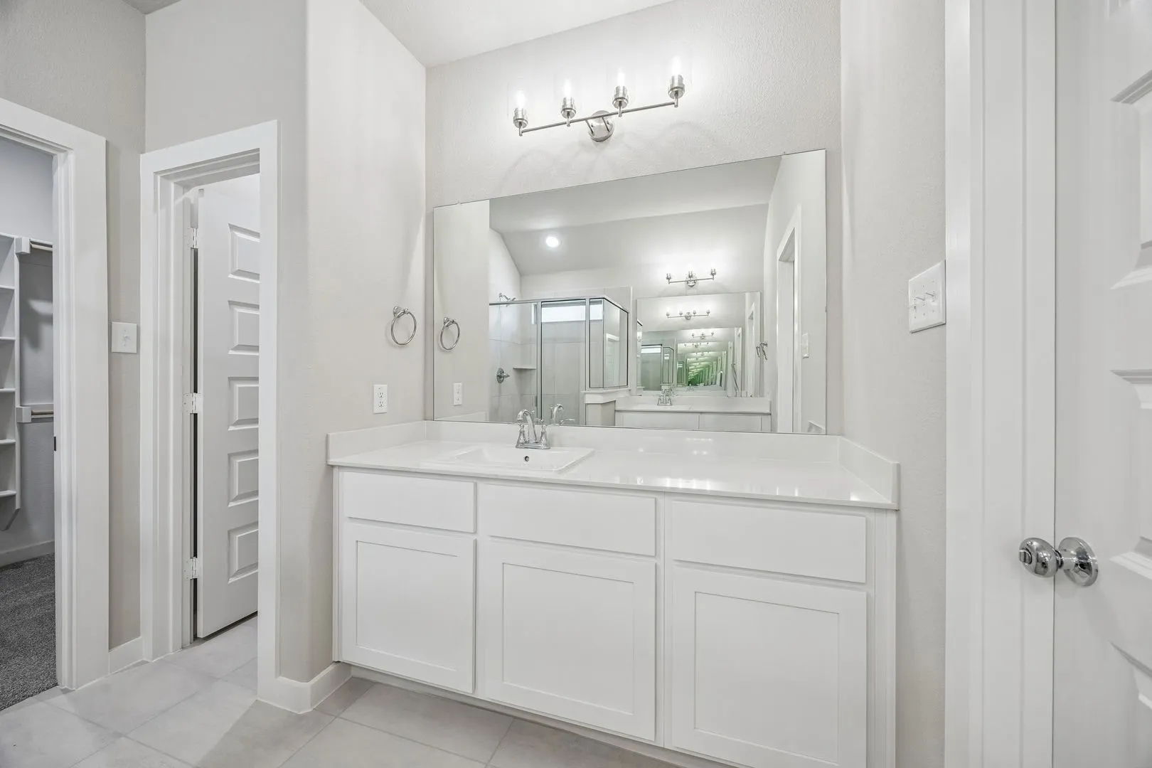 Primary Bathroom in the Heisman home plan by Trophy Signature Homes – REPRESENTATIVE PHOTO