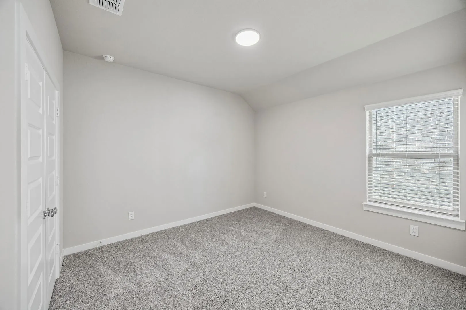 Bedroom in the Heisman home plan by Trophy Signature Homes – REPRESENTATIVE PHOTO