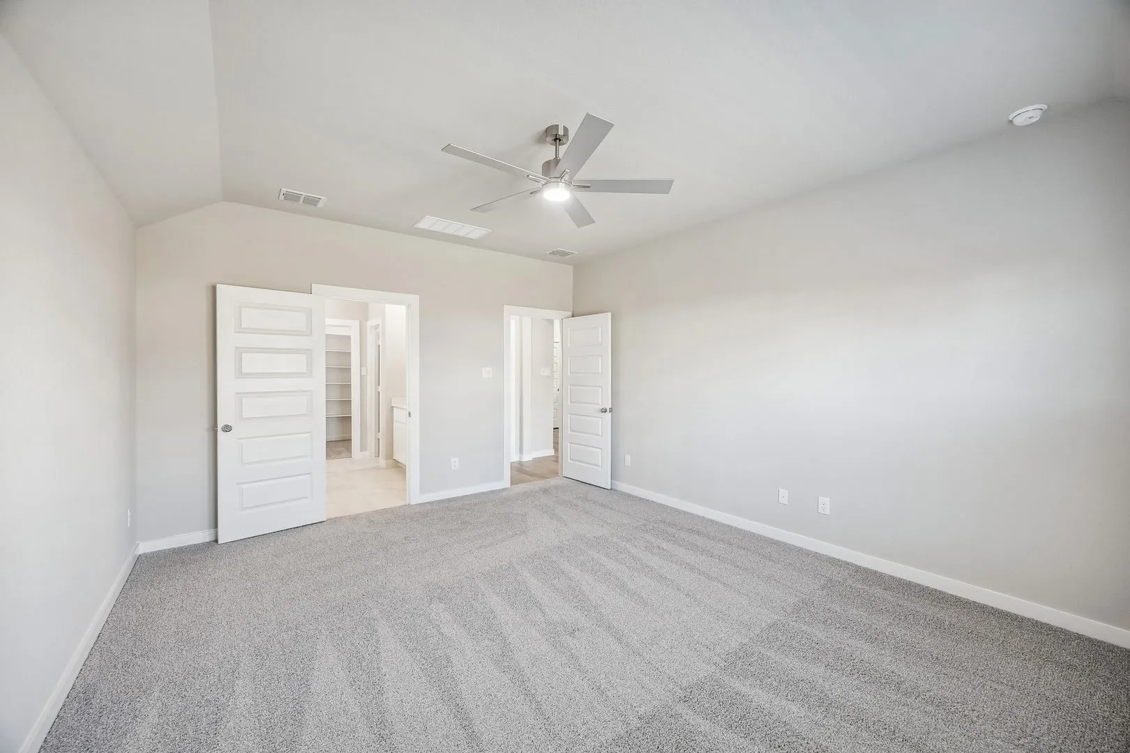 Primary Suite in the Heisman home plan by Trophy Signature Homes – REPRESENTATIVE PHOTO