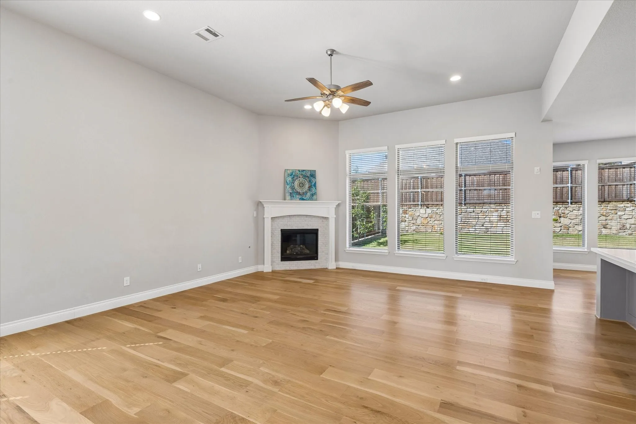 Living room with fireplace and plenty of  natural light