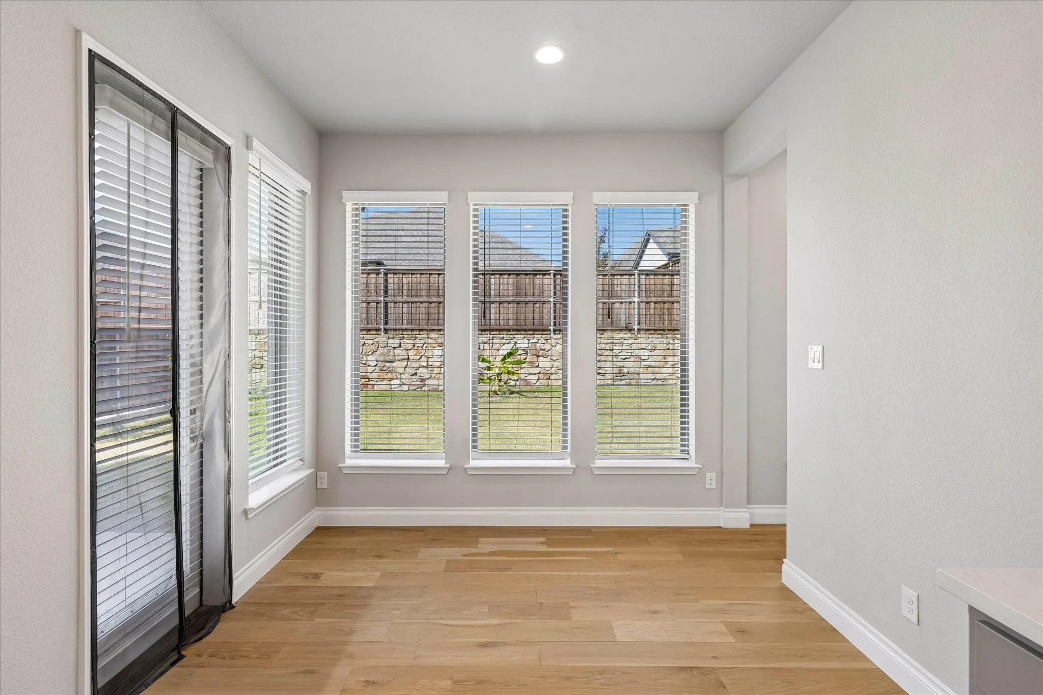 Breakfast room with views of back porch and yard