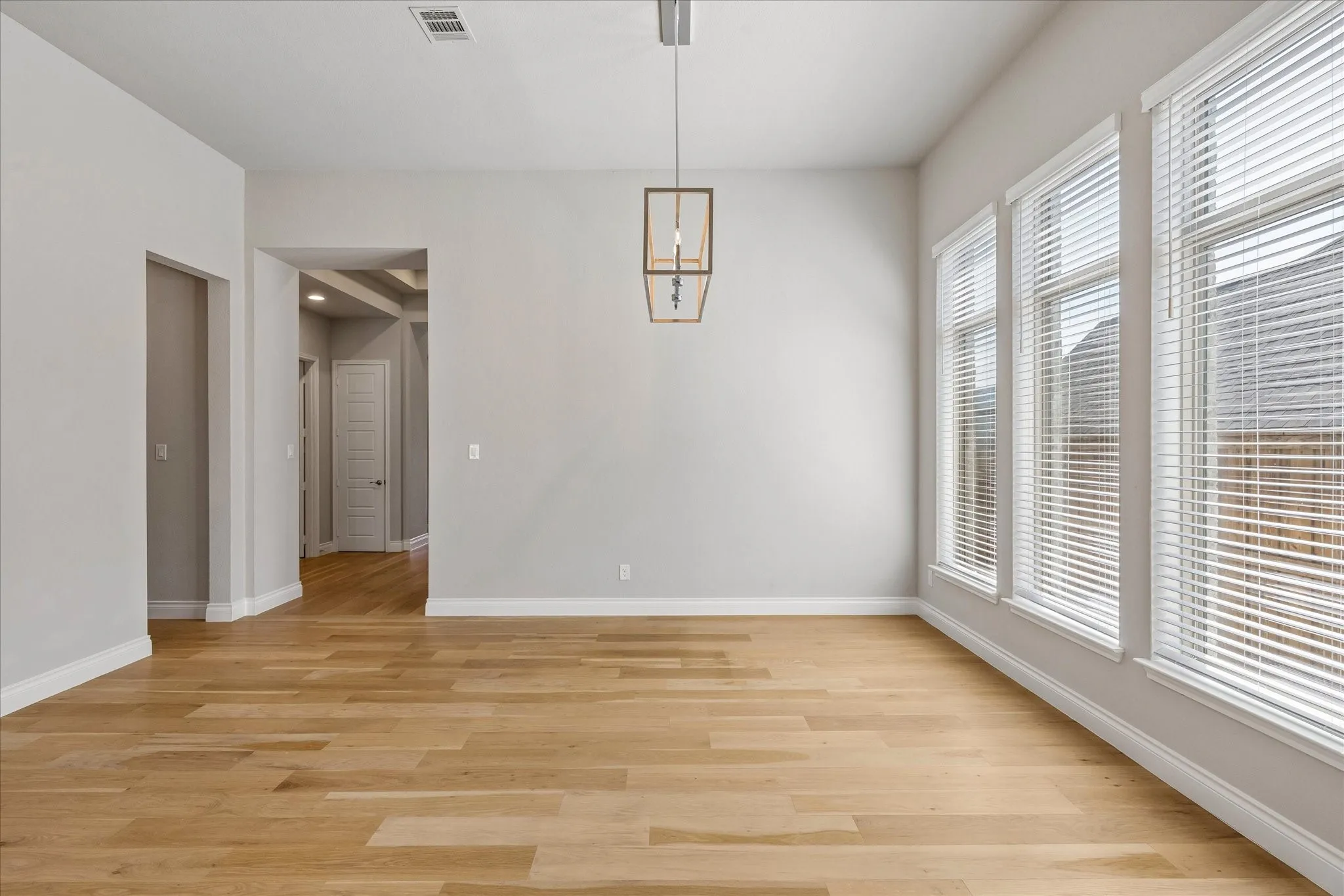 Dining room with large windows bringing in natural light