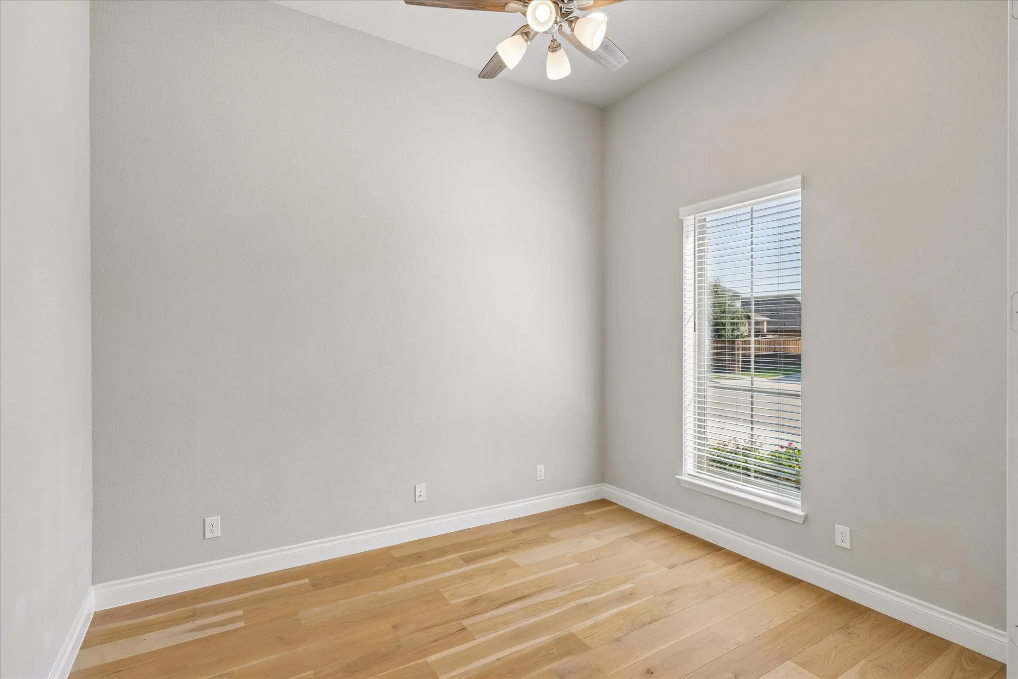 Home office with window view of front yard
