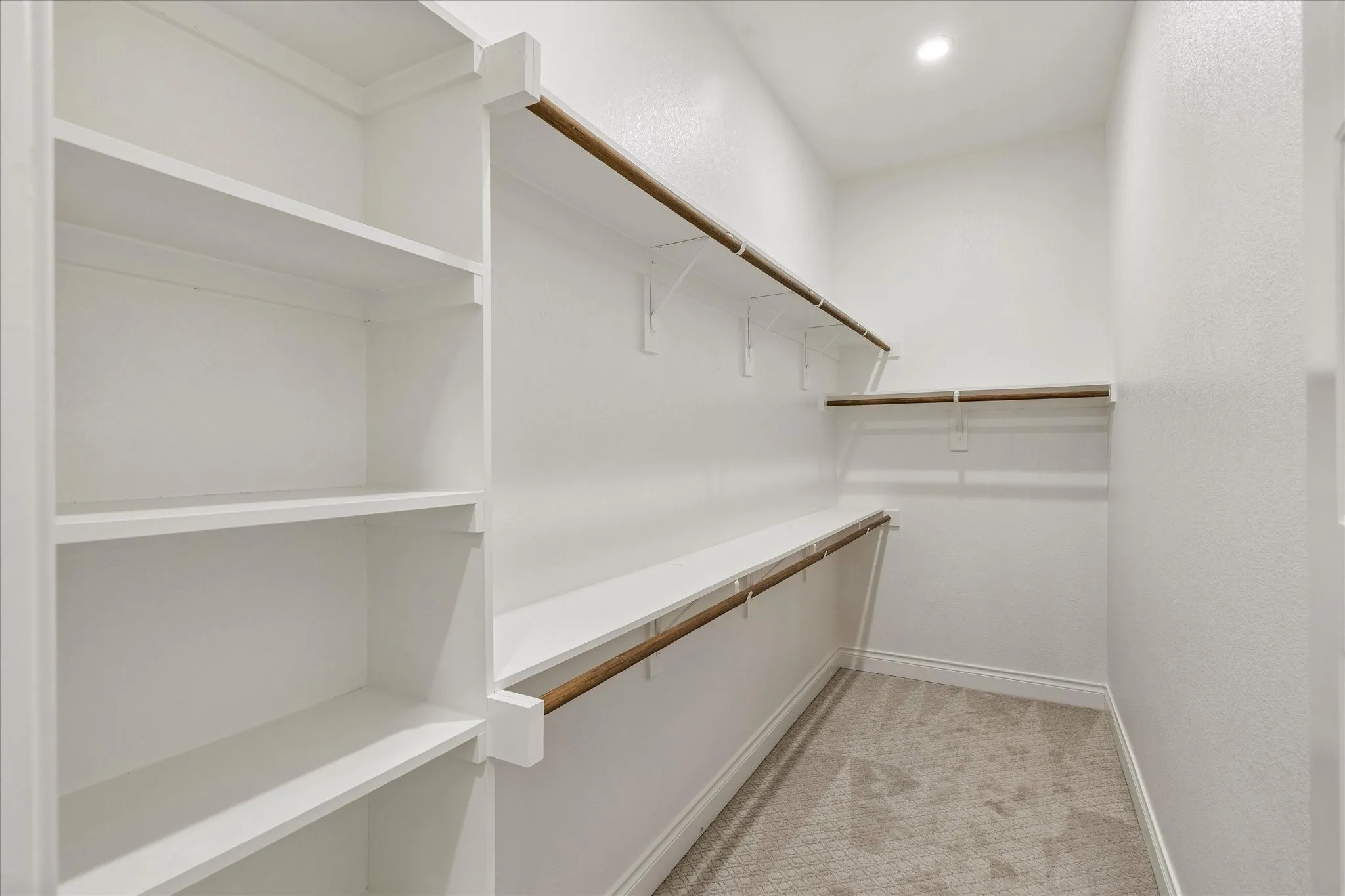 One of two walk-in closet in primary bathroom