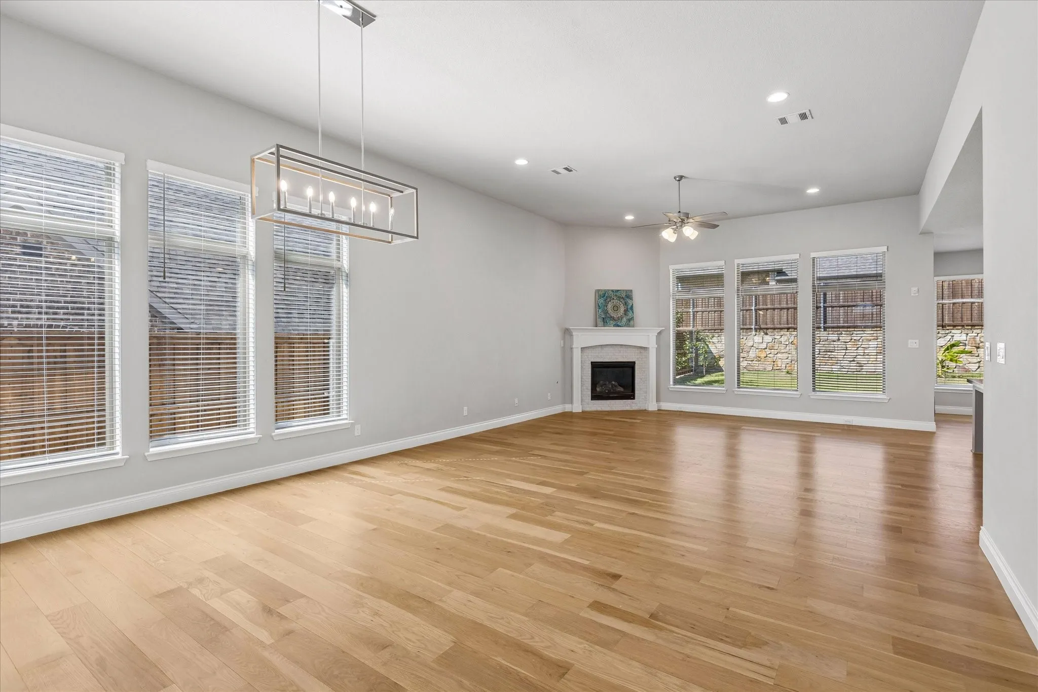 Lots of natural light in this open concept layout with 12 ft ceilings in the dining and living room