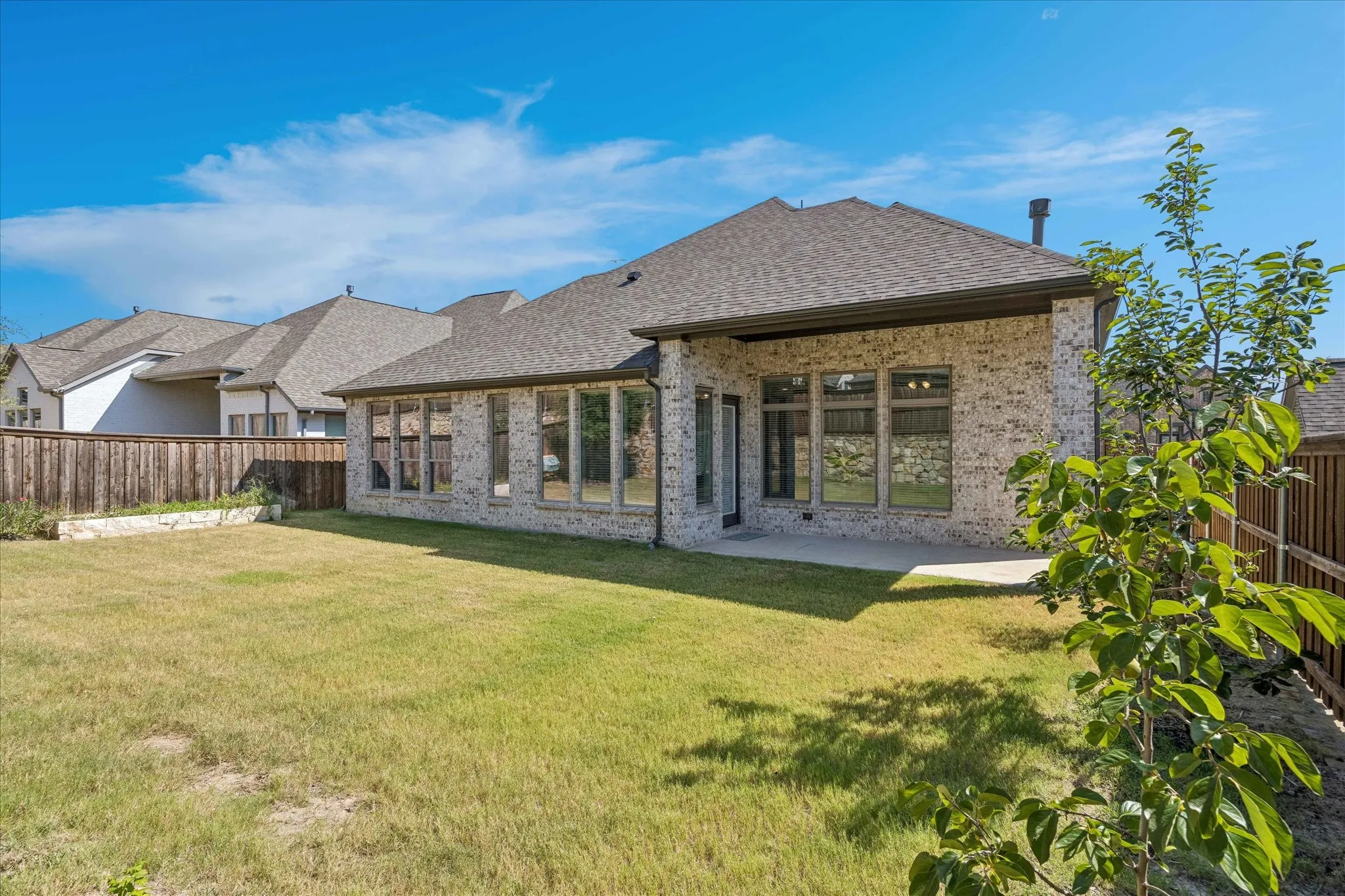 Backyard with irrigation system and covered patio
