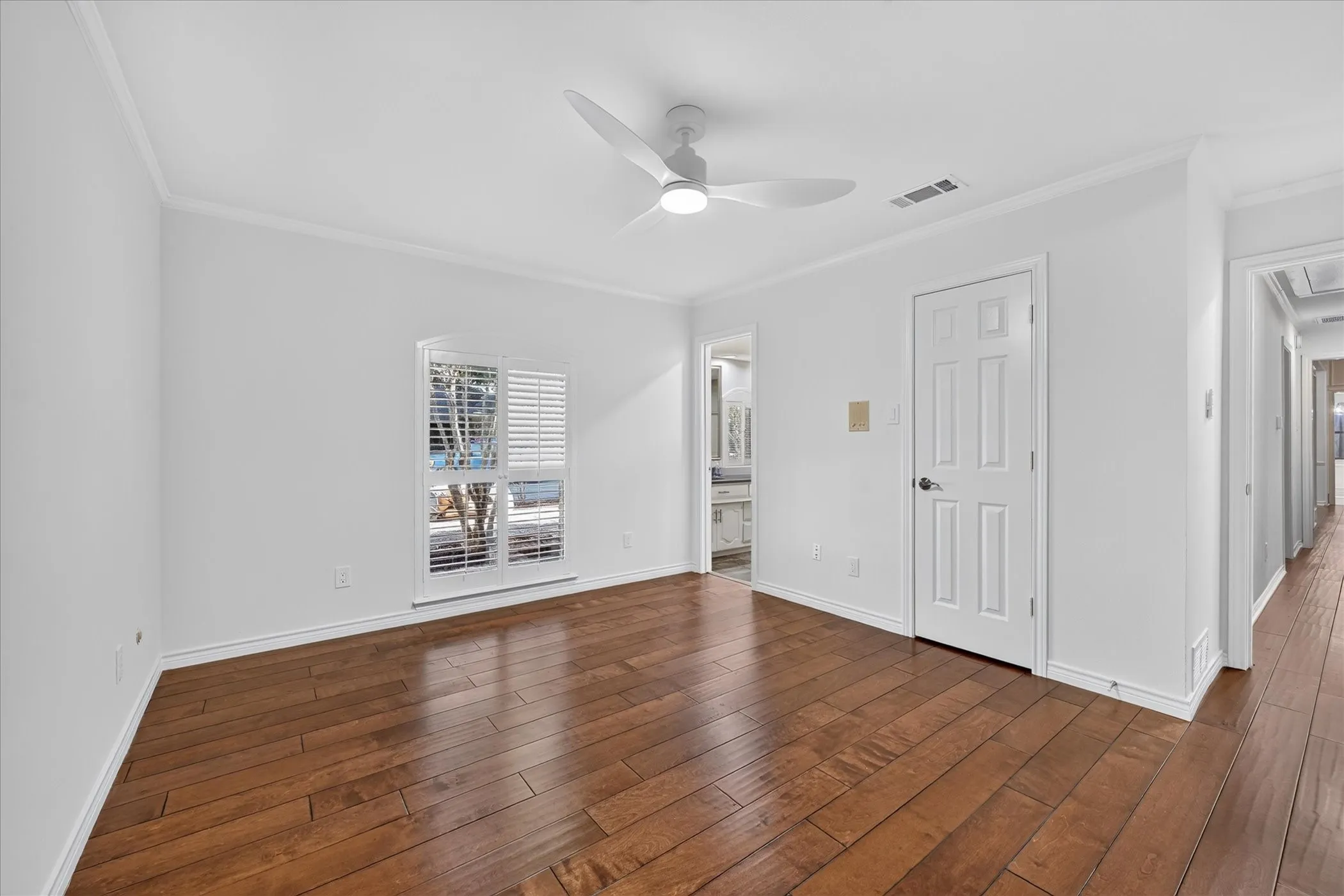 wood-finish flooring, shutters, large closet, ceiling fan