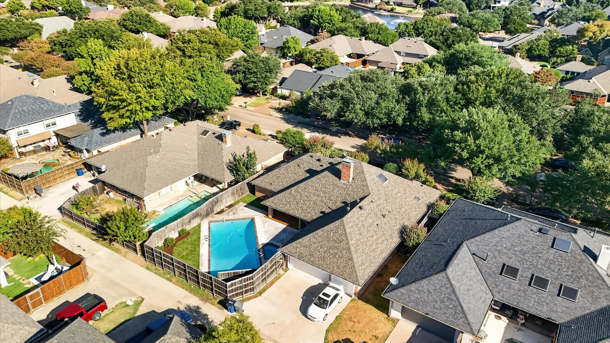 Fenced backyard with an in-ground swimming pool