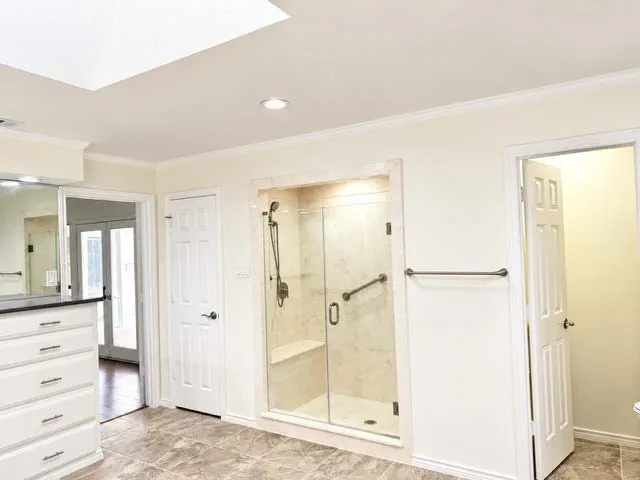 Skylight, recessed lighting, and crown molding