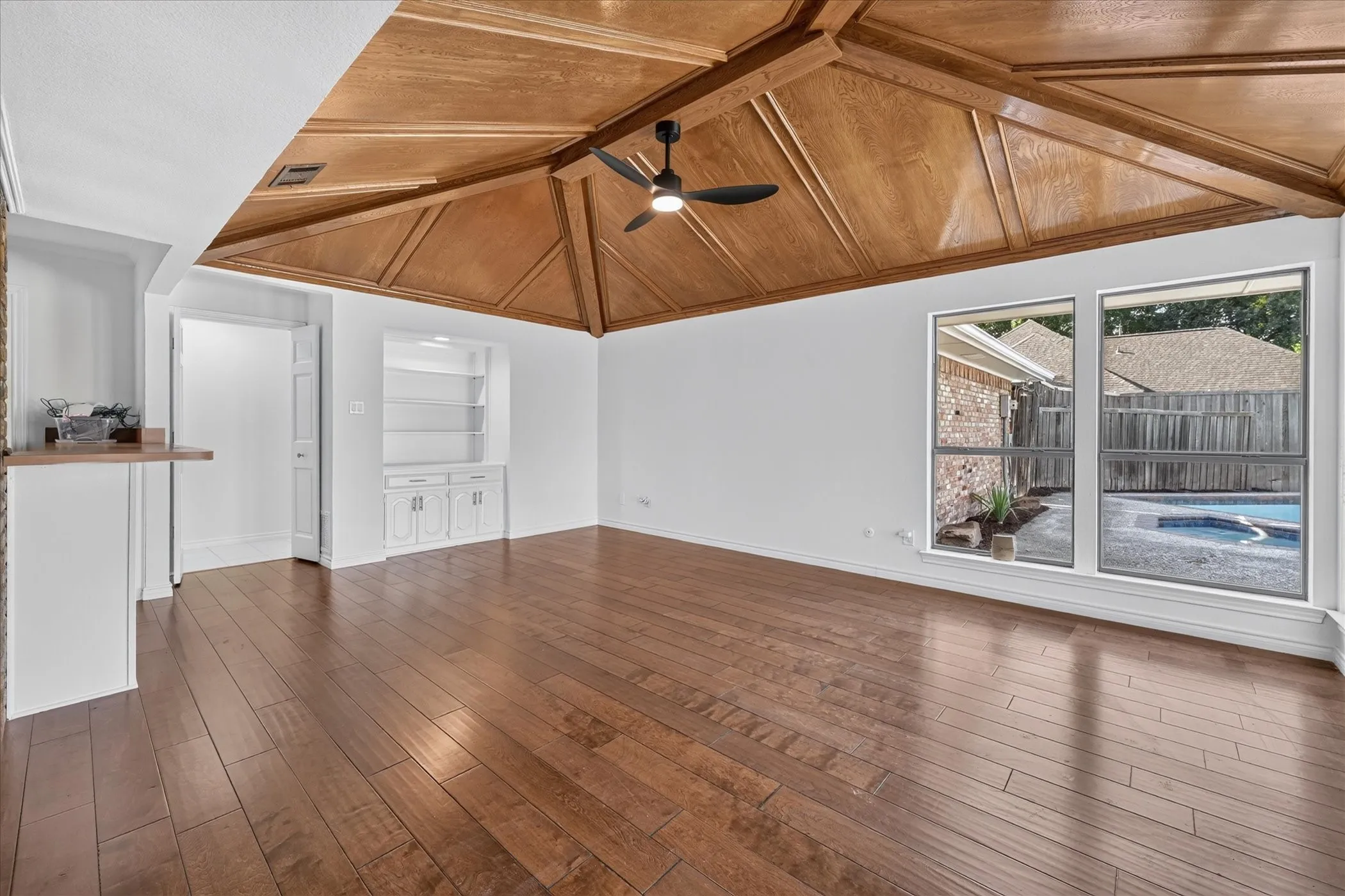 overlooking pool, bar area, vaulted stained ceiling