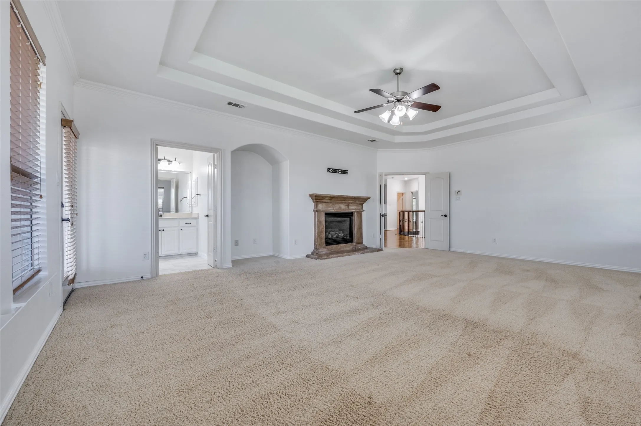 Huge primary bedroom with fireplace.