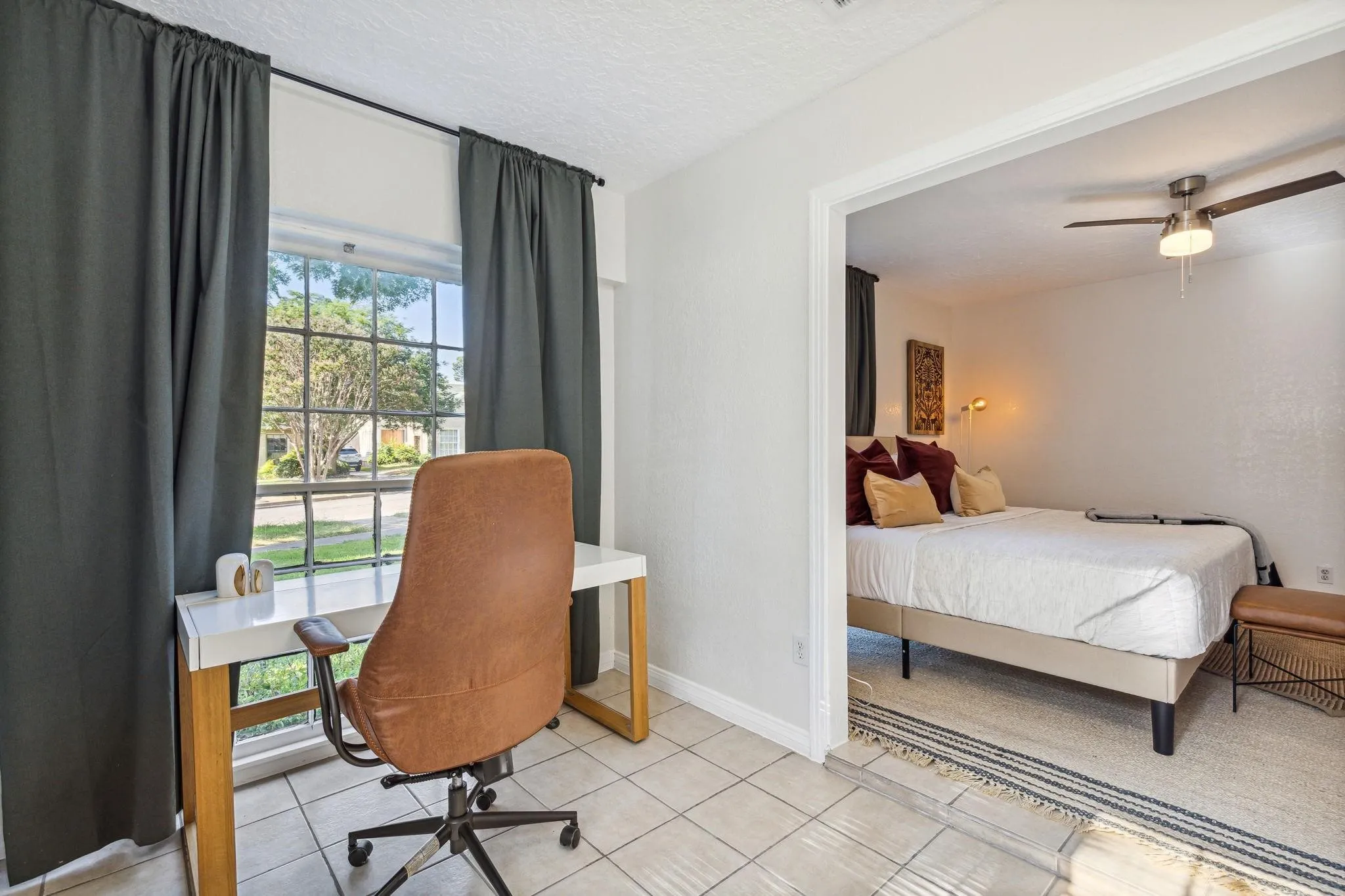 Tile flooring and a window with exterior views