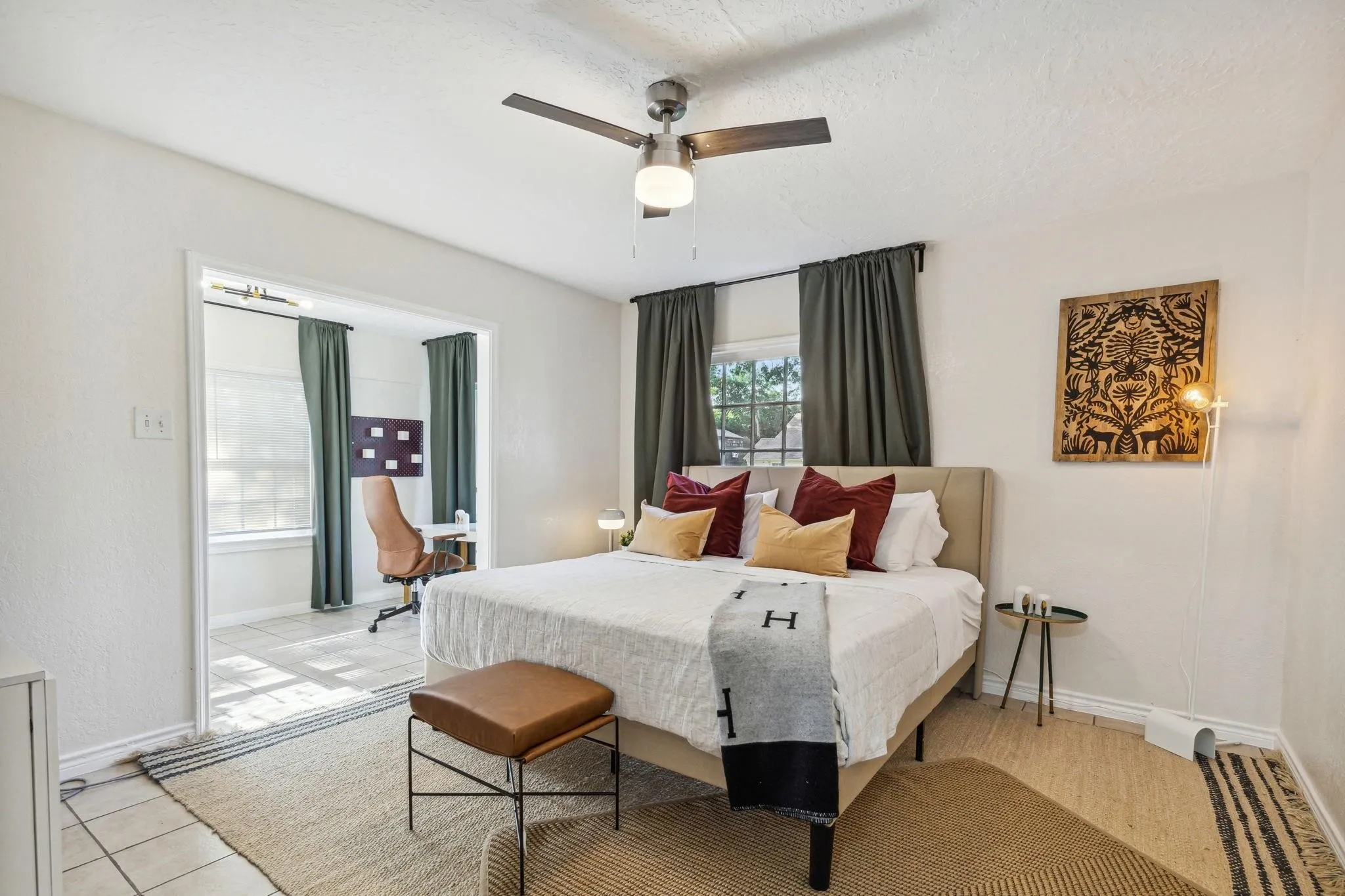 Recessed ceiling fan, textured walls, window with dark drapes, tiled flooring, wood-finish flooring