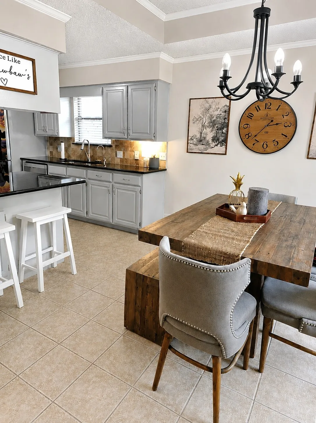 Kitchen featuring light gray cabinetry, dark countertops, a tiled backsplash, and recessed lighting