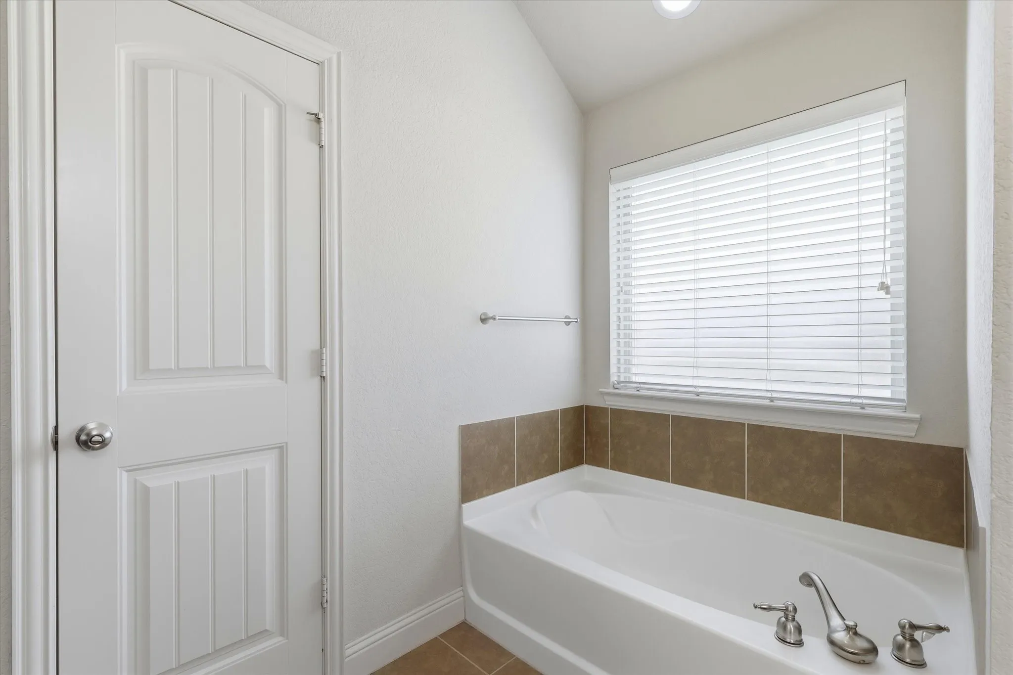 White paneled door with chrome hardware