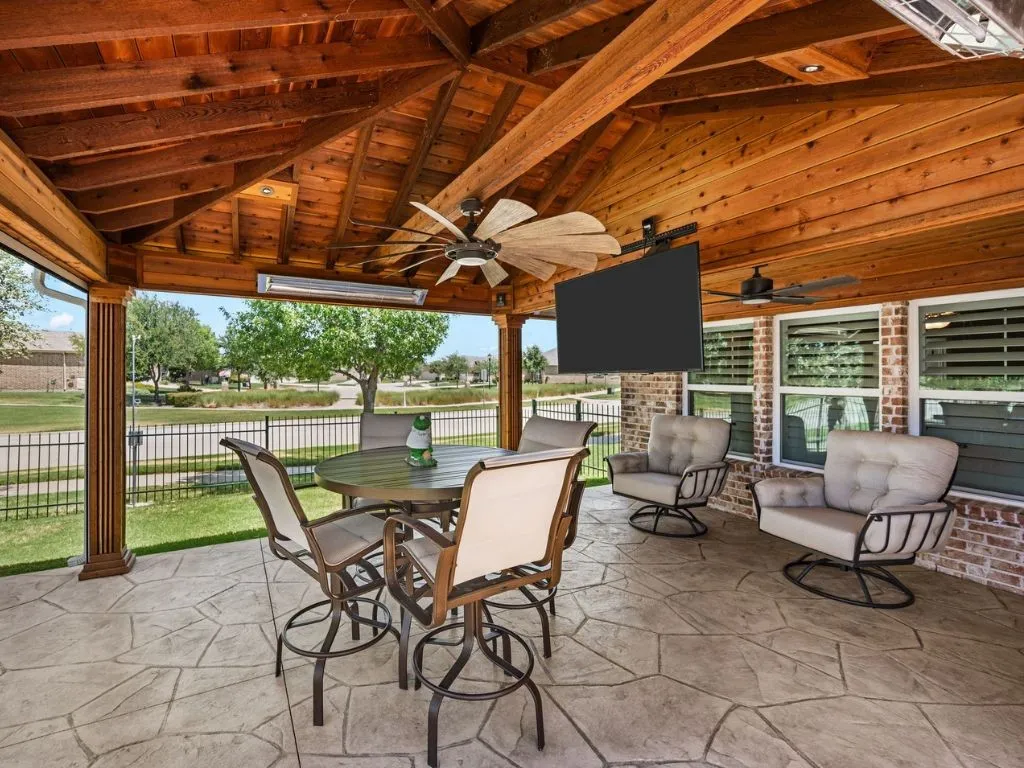 Outdoor living with full covered patio and drop down TV.