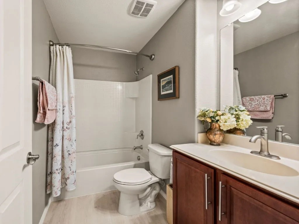 Guest bathroom has luxury wood vinyl flooring