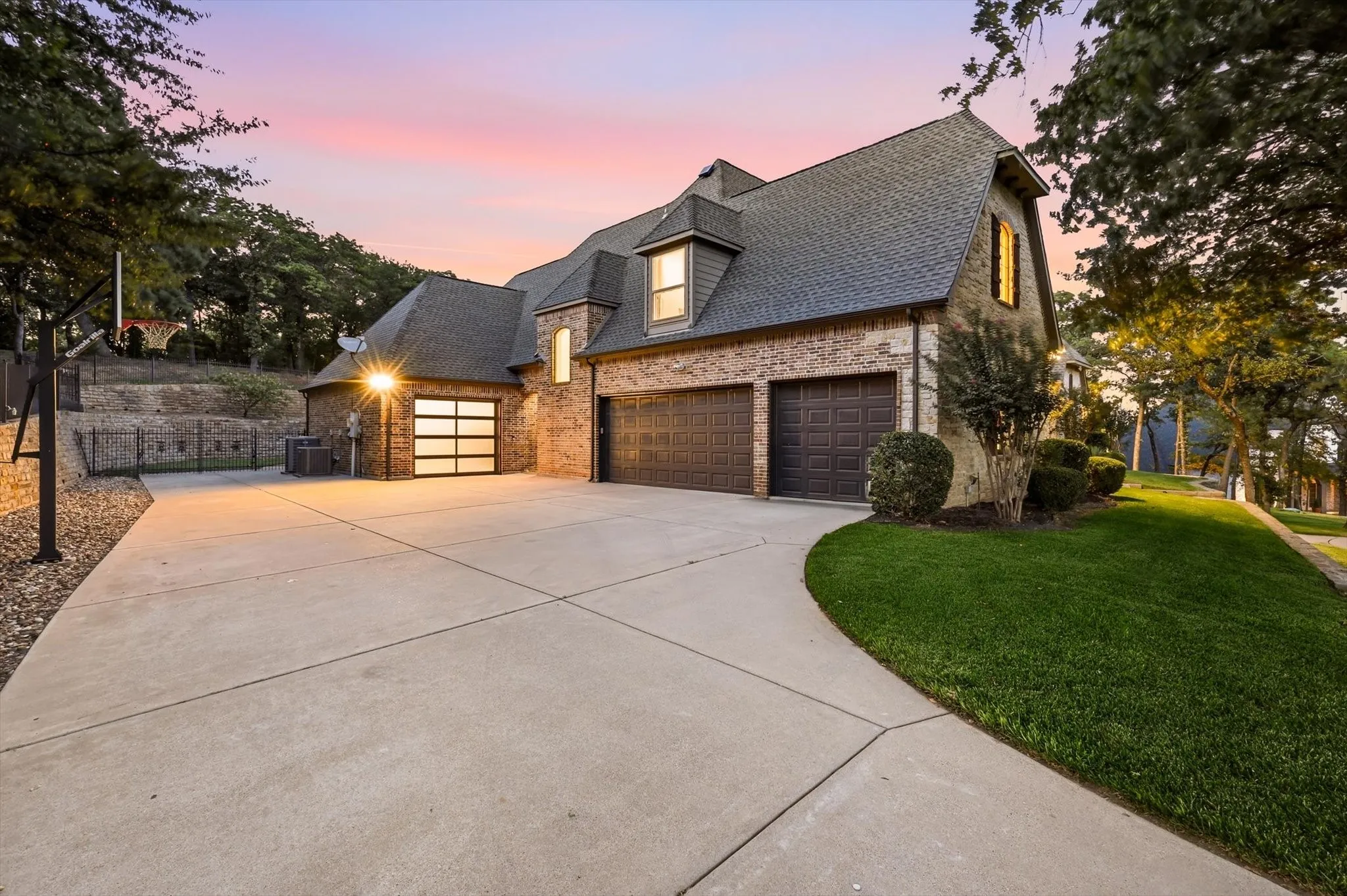 Brick exterior with a peaked roofline, offering multiple garage bays