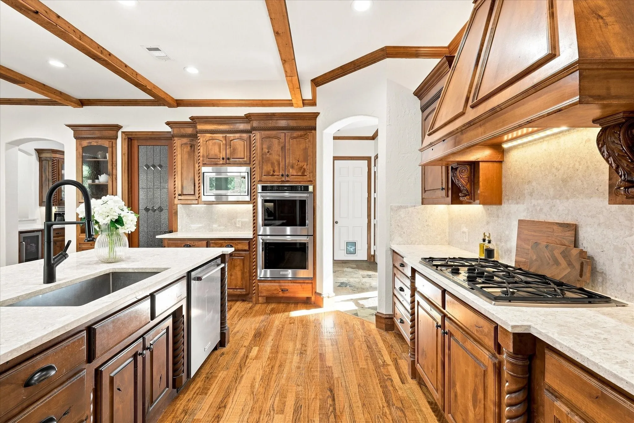 Wood-finish flooring with exposed ceiling beams