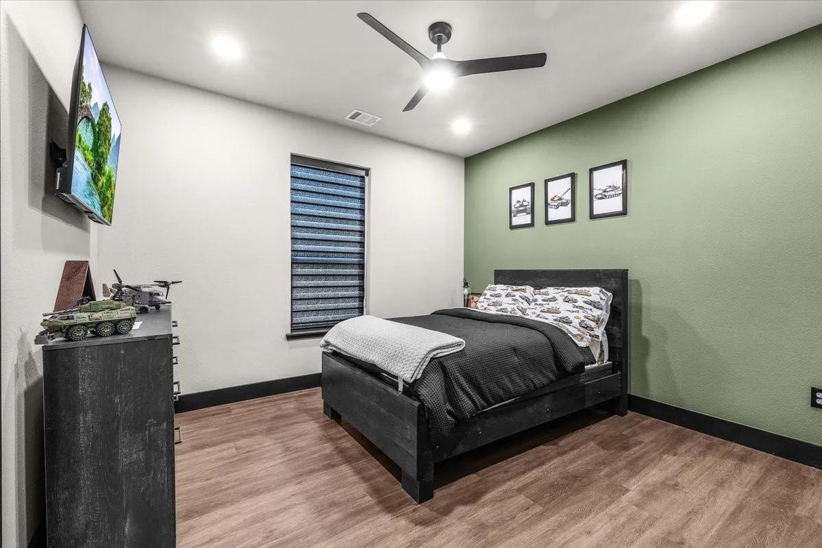 Wood-finish flooring, recessed lighting, and a ceiling fan