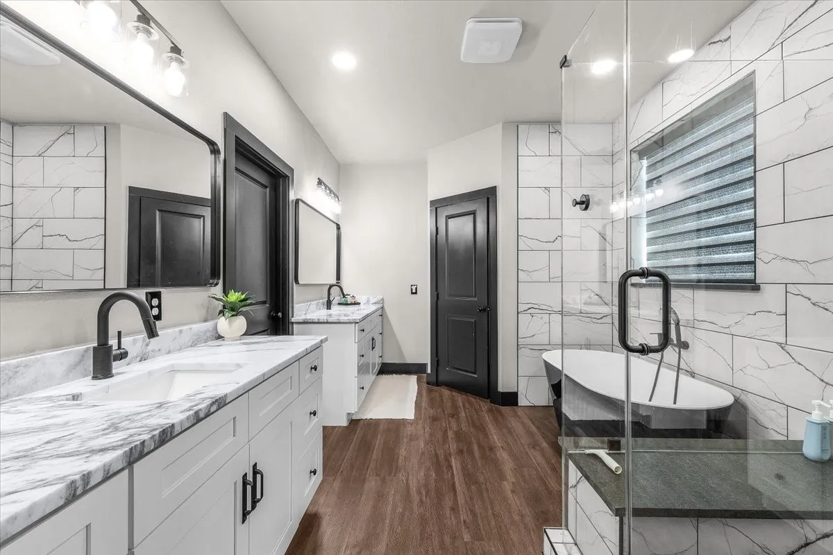 Dual vanity with stone countertops and undermount sinks