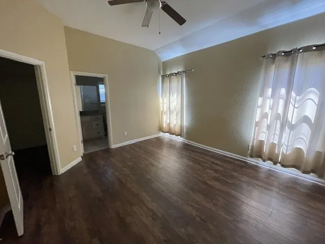 ceiling fan, wood-finish flooring, and neutral wall tones