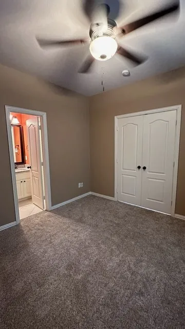 Guest Primary room on the first floor, a double-door closet, and neutral-toned walls