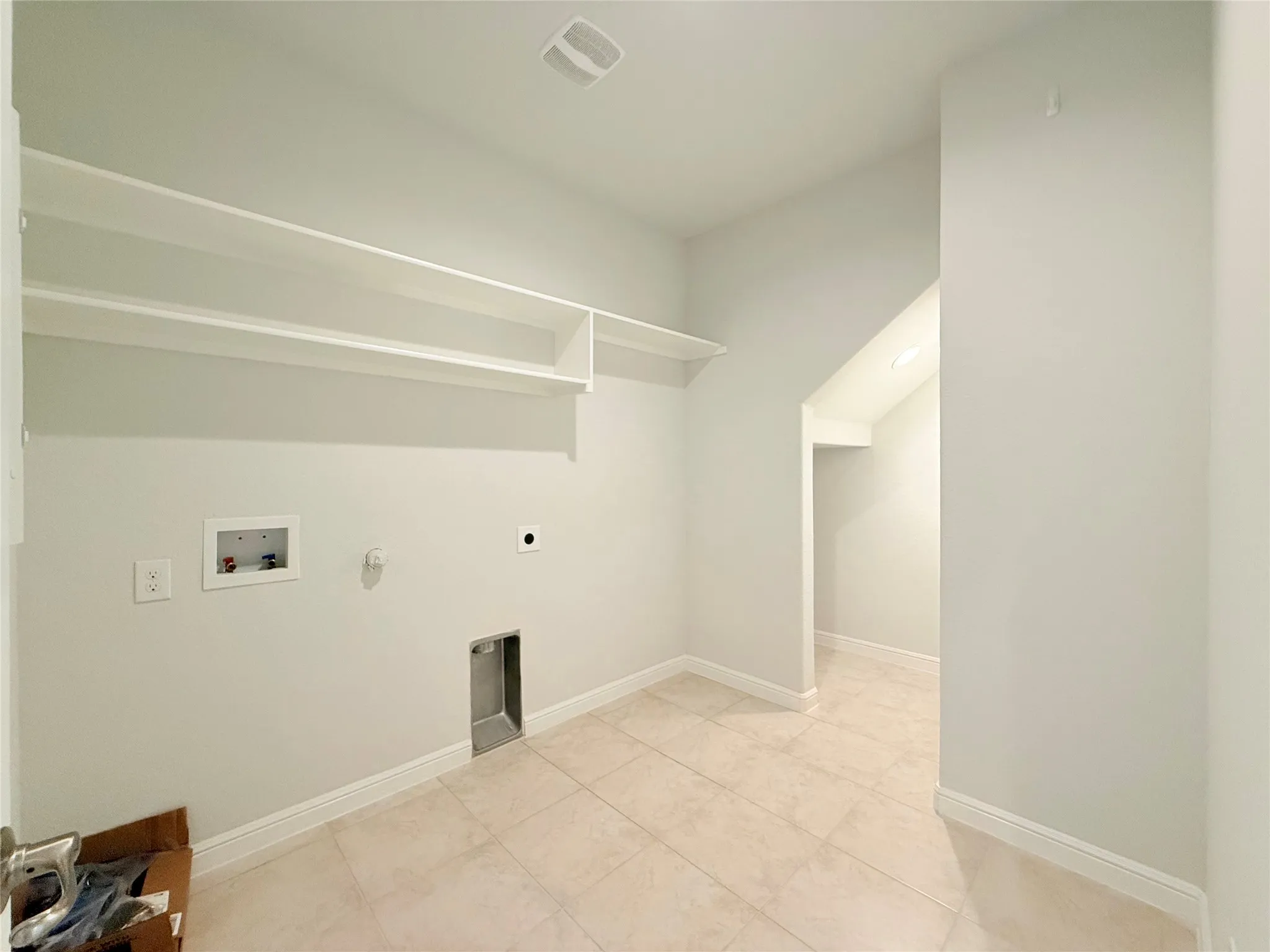 Recessed lighting, tile flooring, and built-in shelving