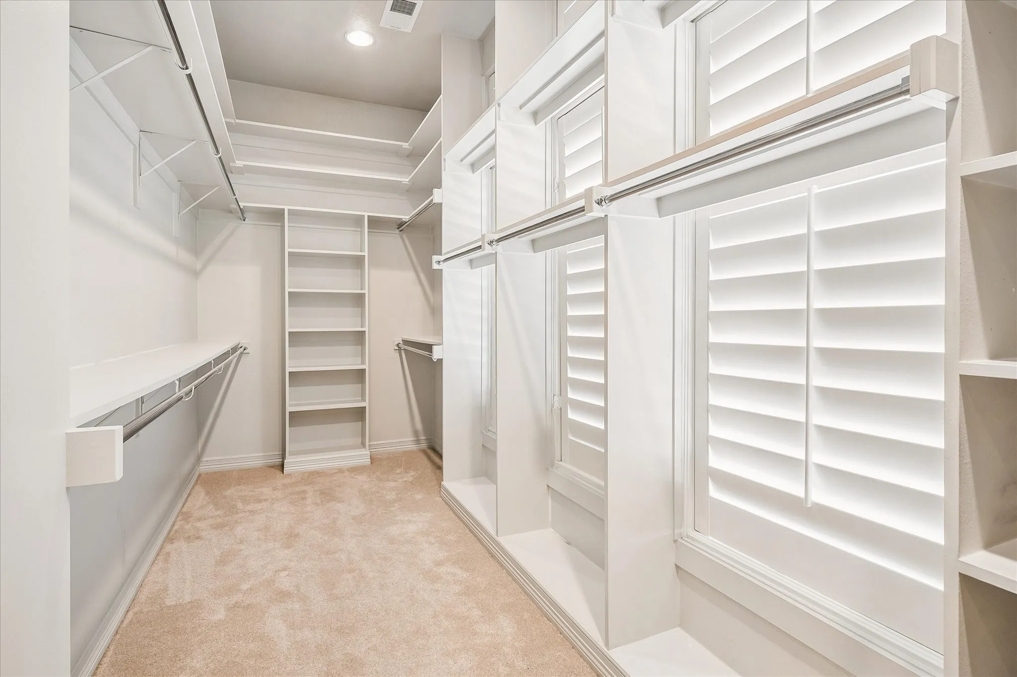Primary bedroom walk-in closet is massive