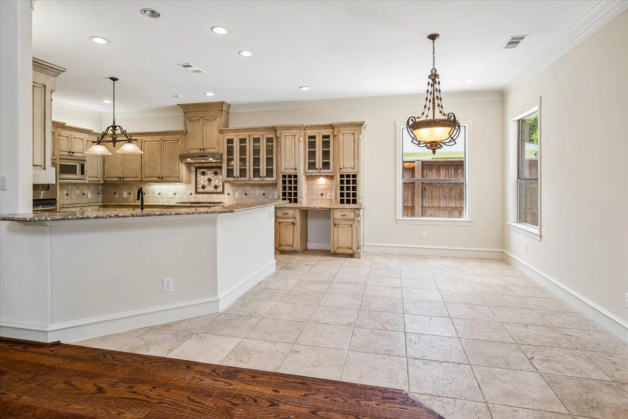 Breakfast bar and eat-in kitchen open to family Room