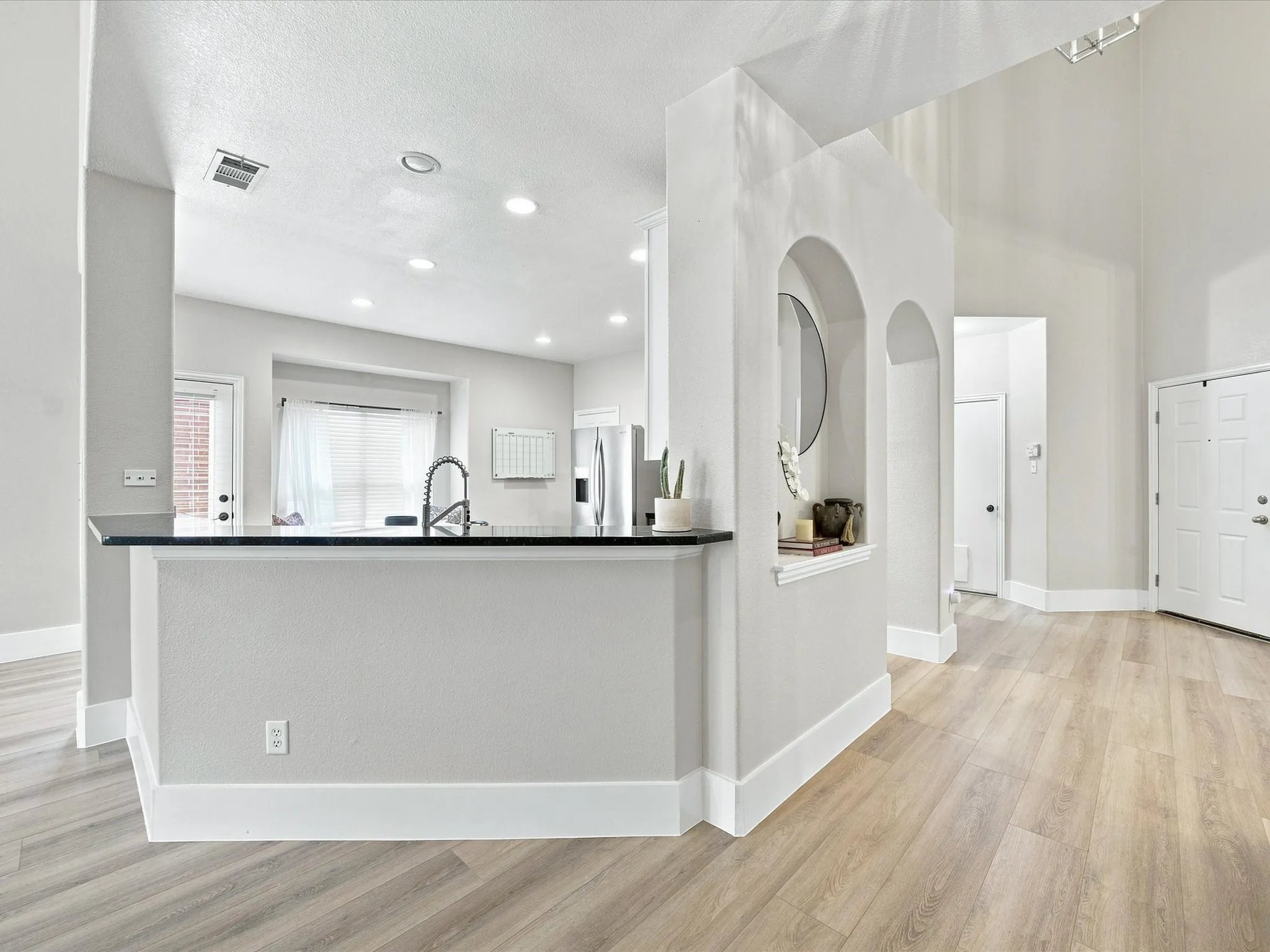 Kitchen Breakfast bar area looks out from kitchen to living room space.