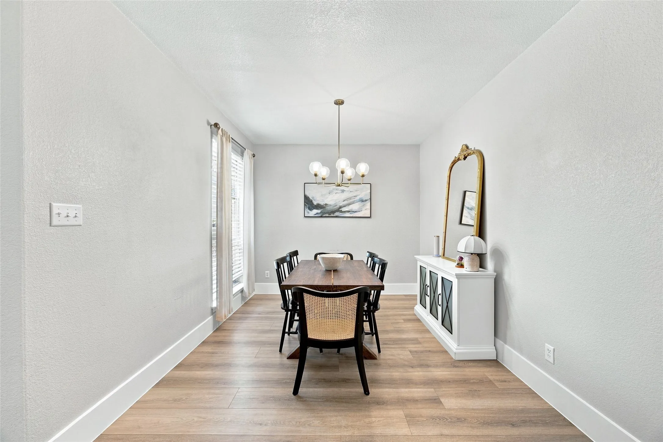This formal dining are gives plenty of space for family and friends.  The dining area is directly off the kitchen, convenient for serving and entertaining.