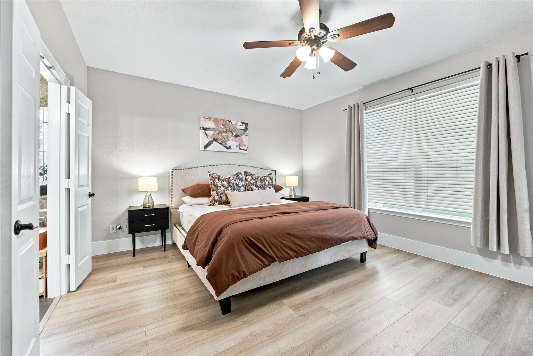 Spacious master bedroom boasts a large window looking out over the backyard.  The bedroom allows plenty of space for all your furniture and has french doors that lead you to the ensuite bathroom.