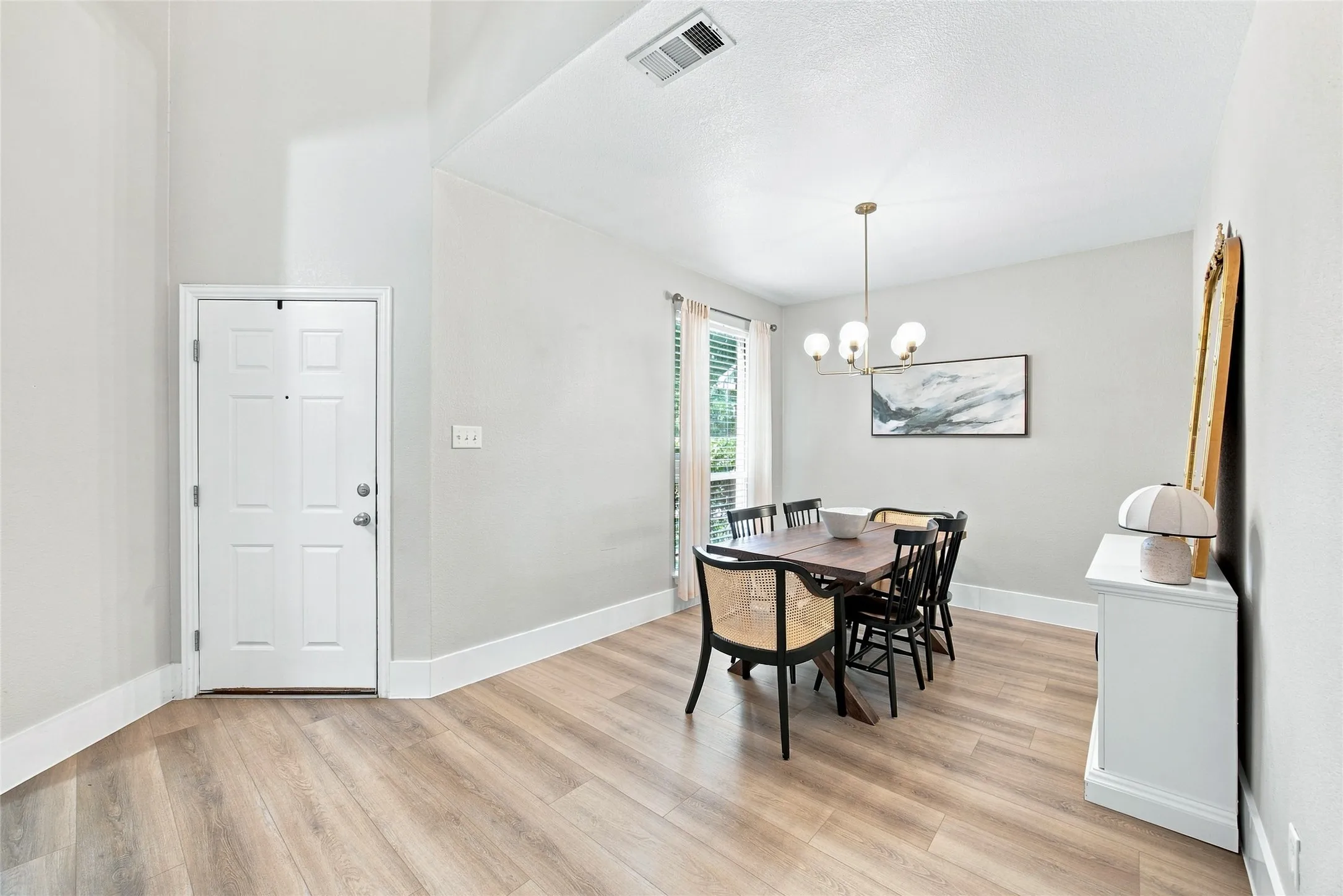 Foyer Entrance of home leads you directly through open space passing the dining room into the living room areas