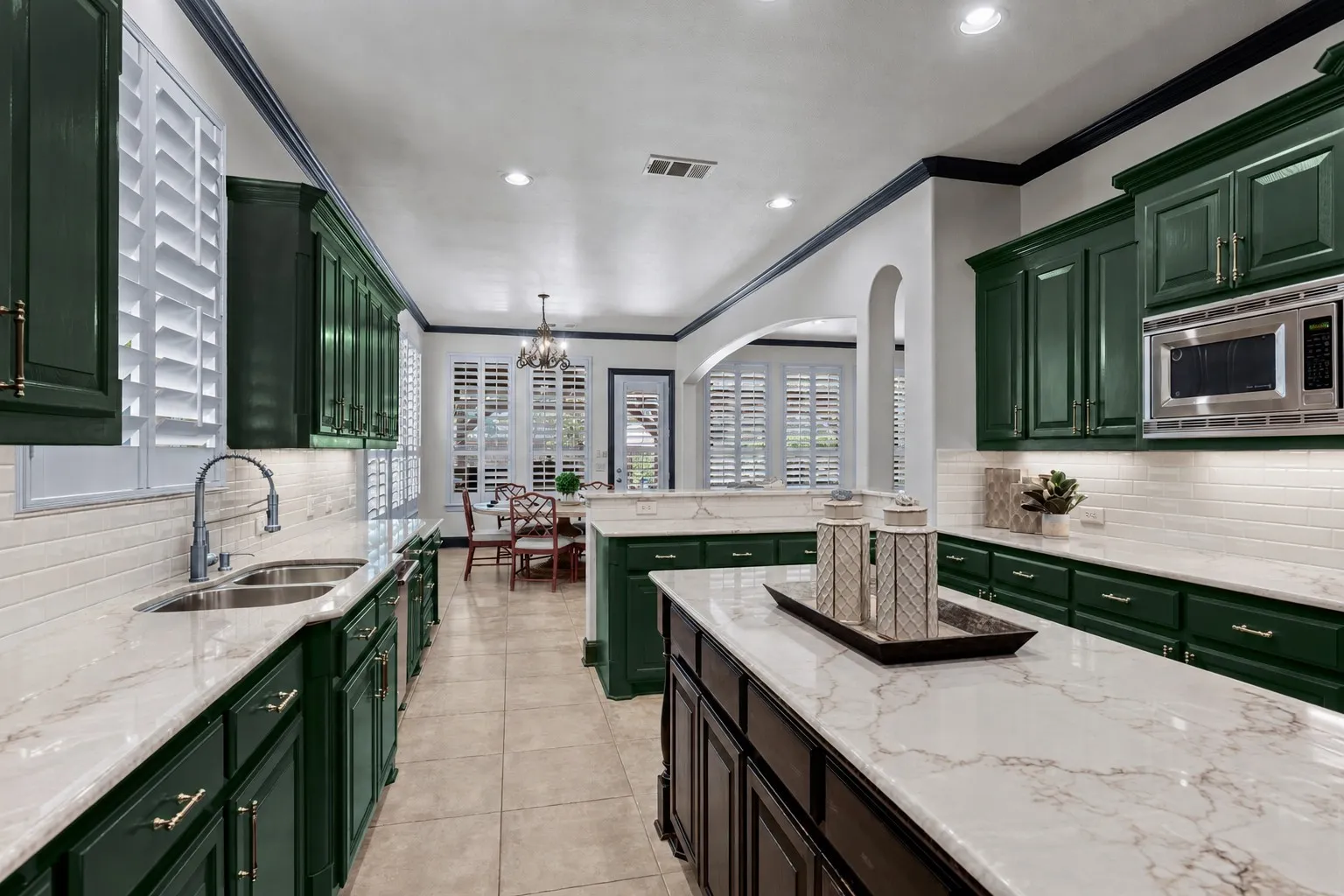 This is a virtually edited representation of what quartz countertops and subway tile backsplash could look like in home. Actual countertops and backsplash are not in home currently.