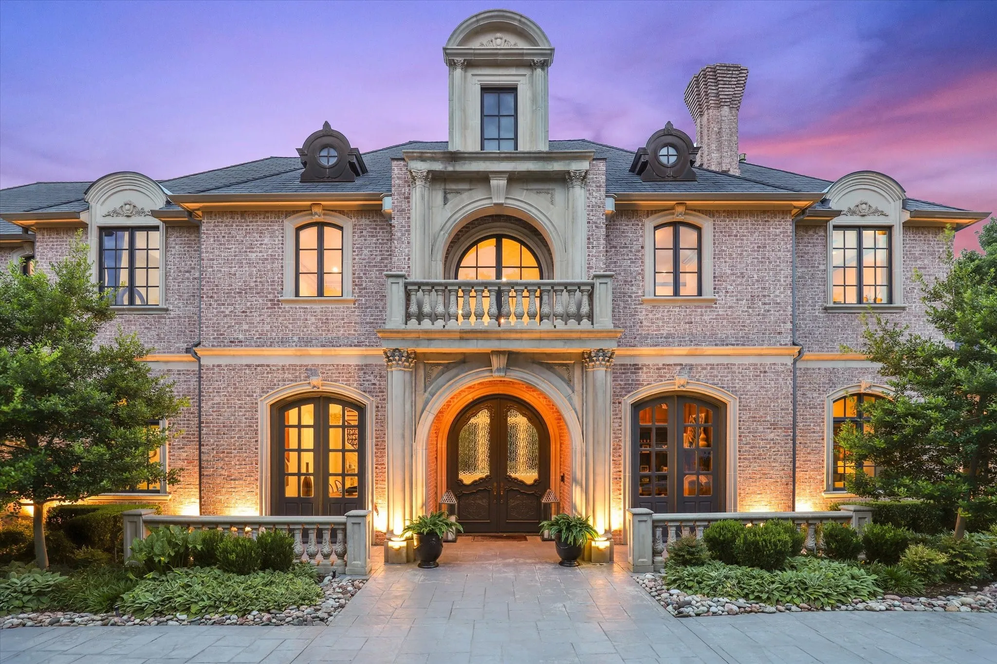 This French inspired Estate is a beauty with gorgeous drive up appeal and a circular driveway and a side gated driveway.