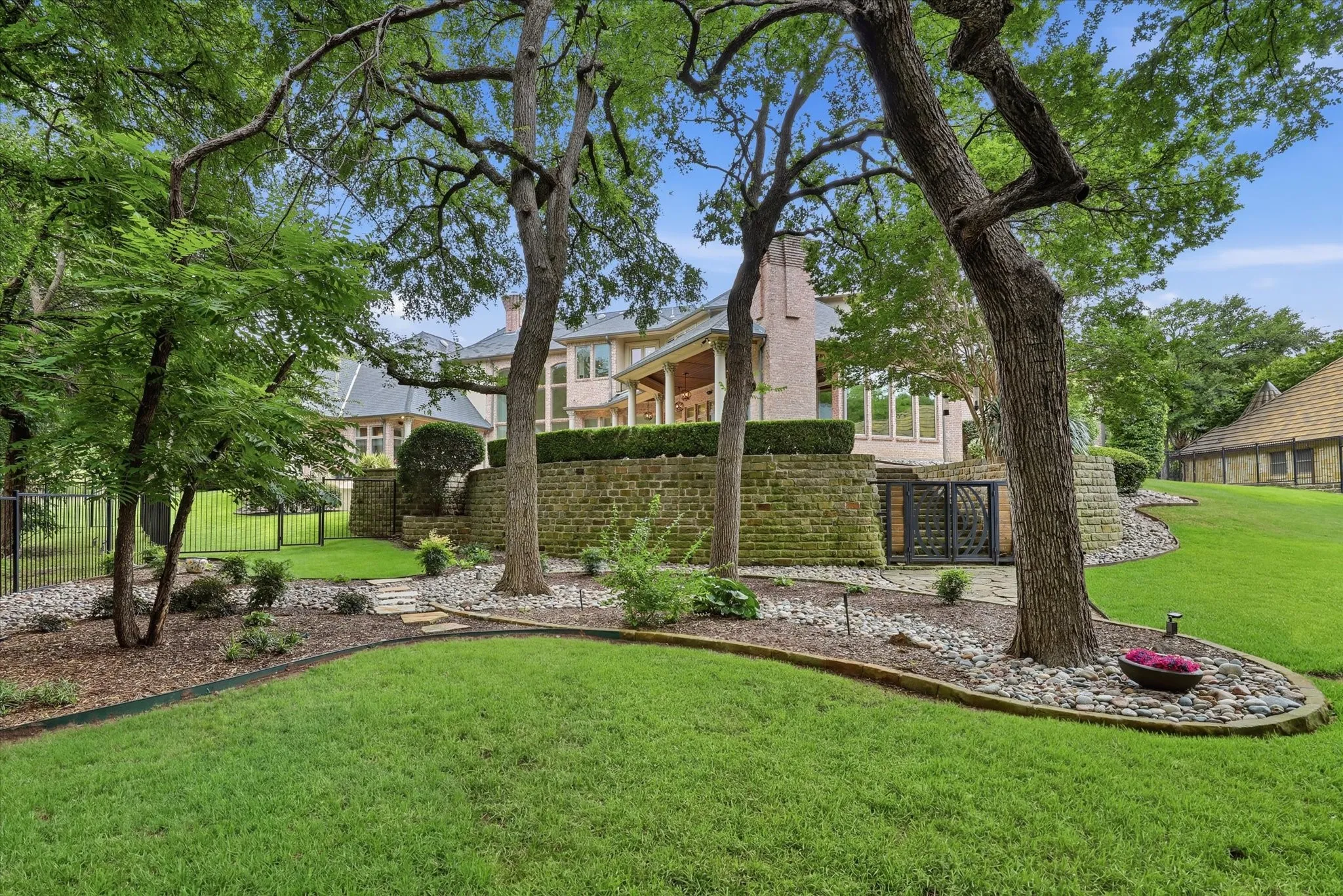 There's enough room to spread out and for whatever you want in this back yard, and it backs to a creek!