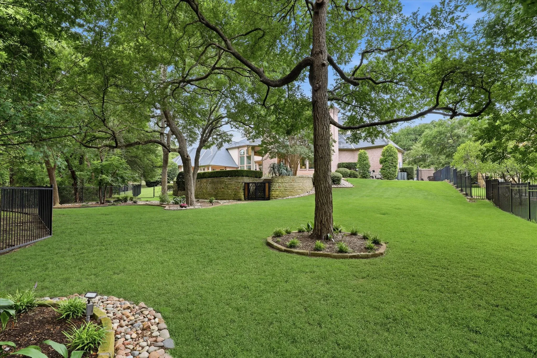 The lot is .74 Acres and is stunning with trees and beautiful landscaping.