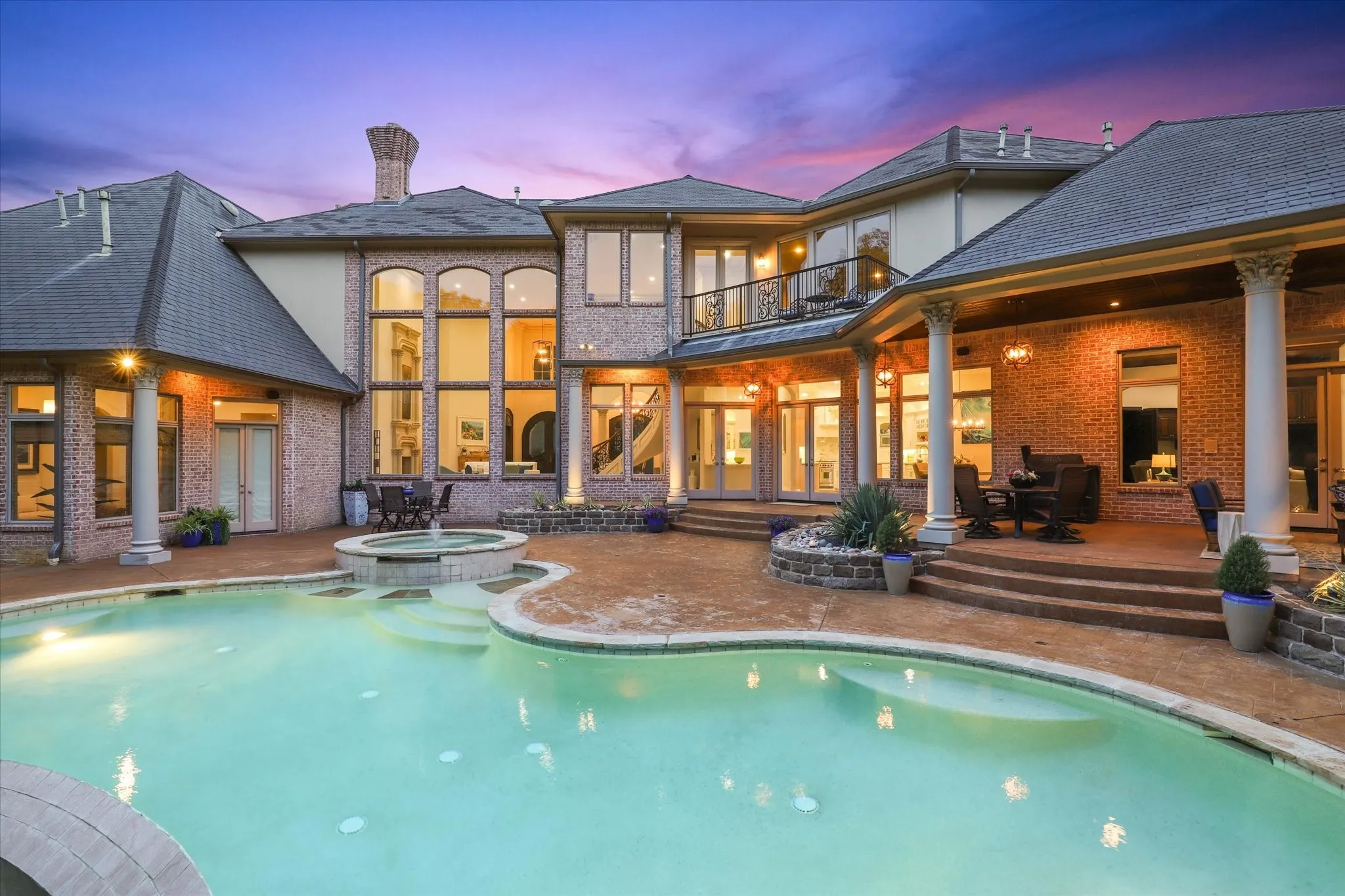 The back yard is truly resort like with a sparkling Infiniti edge pool and spa and a covered outdoor living area with fireplace.