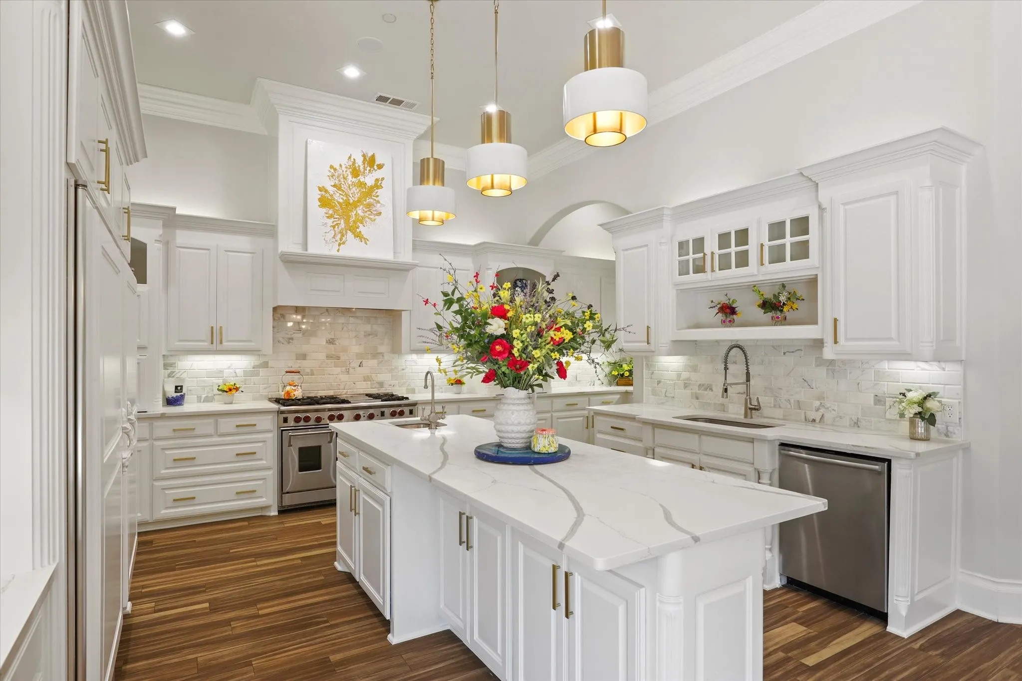 The Kitchen is a show piece and offers stunning updates including quartz countertops, a built in Sub Zero refrigerator and freezer, a professional Wolf Range, prep sink and 2nd pantry.