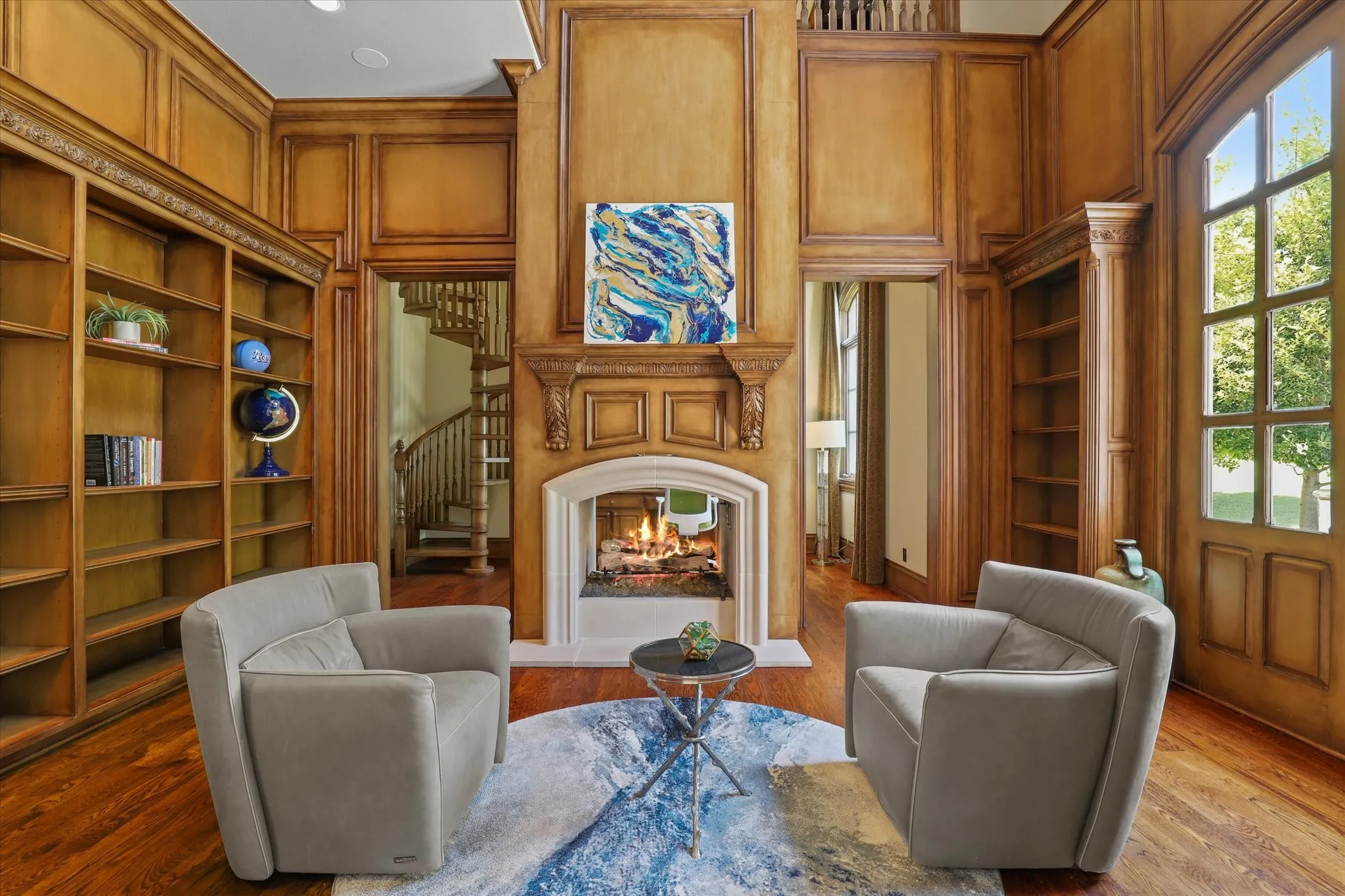 The Den is a part of the Study with buiilt-ins and a beautiful see through fireplace.