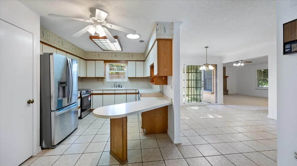 Kitchen with new stainless appliances.