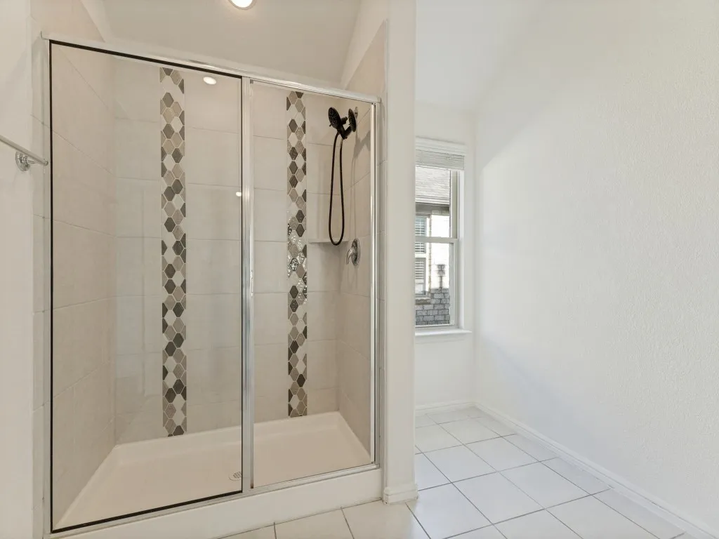 Picture was taken previously. New glass shower door has been installed.