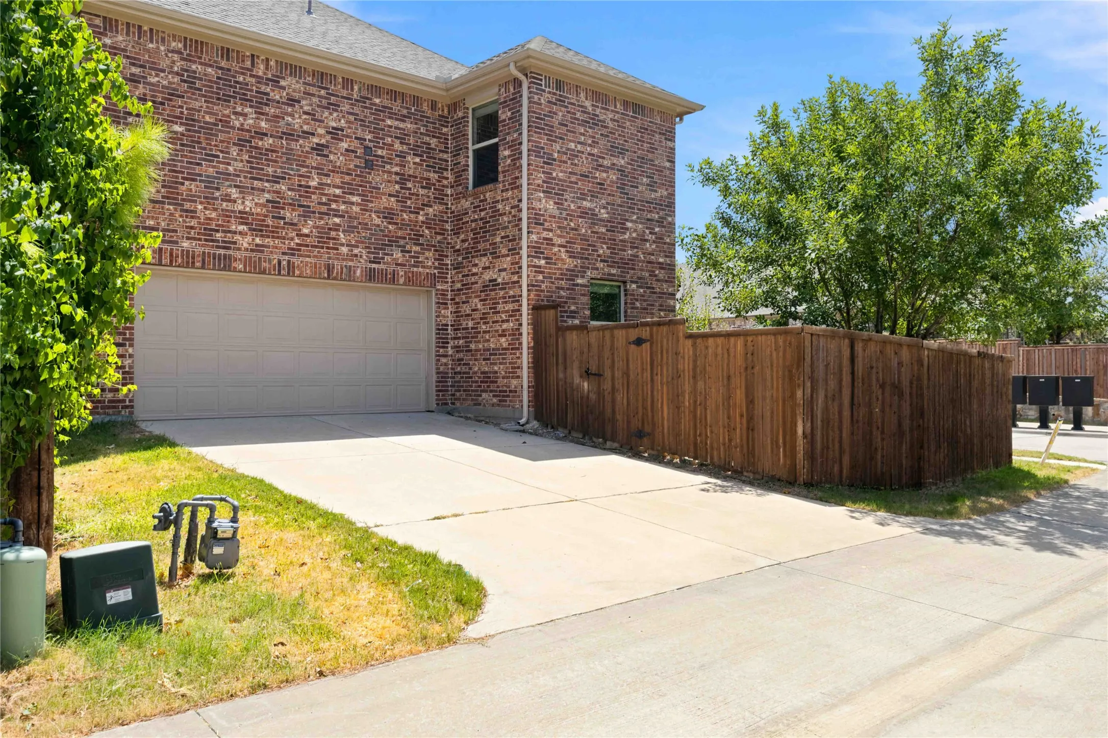 Brick facade with a prominent two-car garage