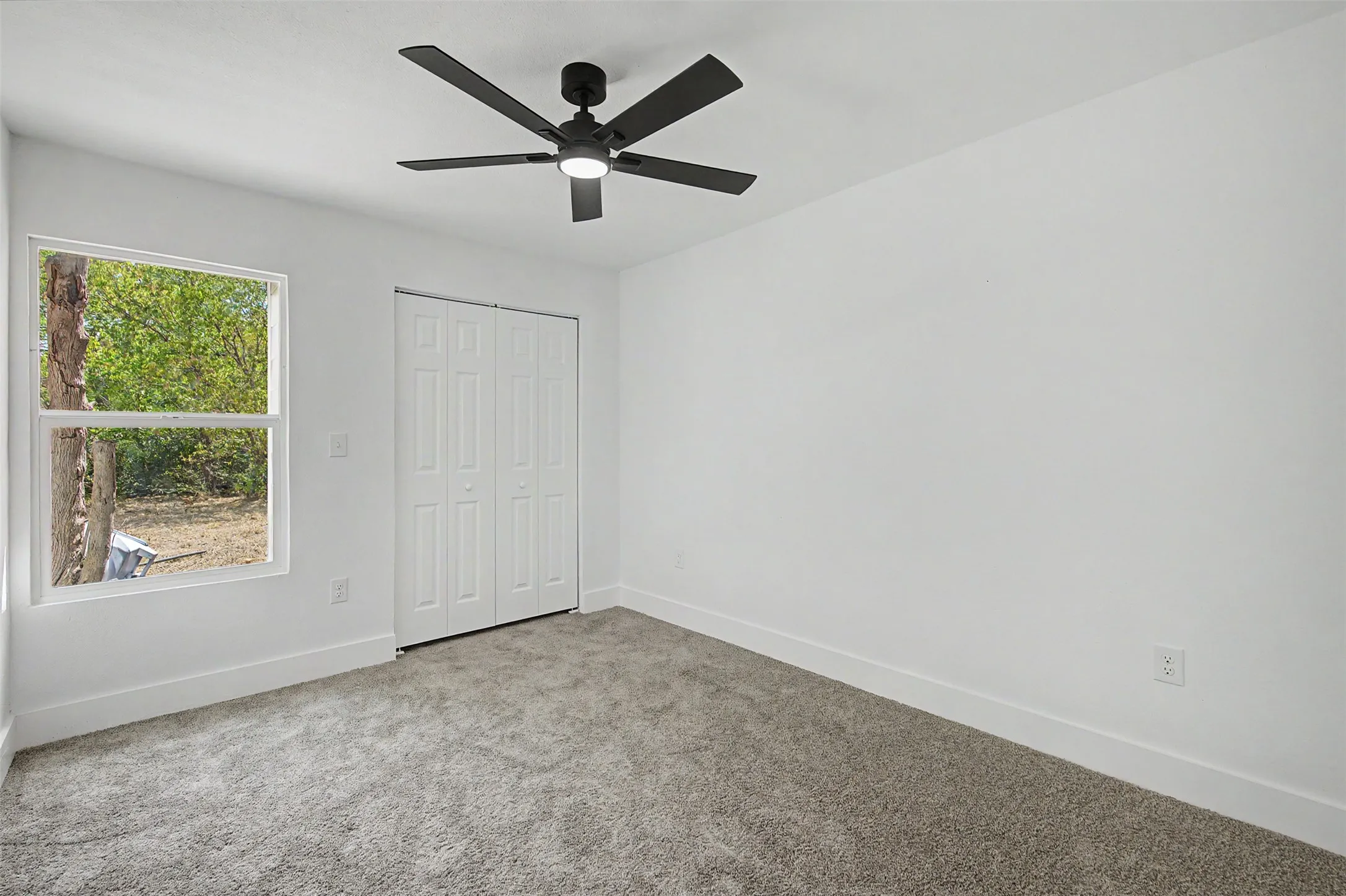 Neutral gray carpet with white walls and trim