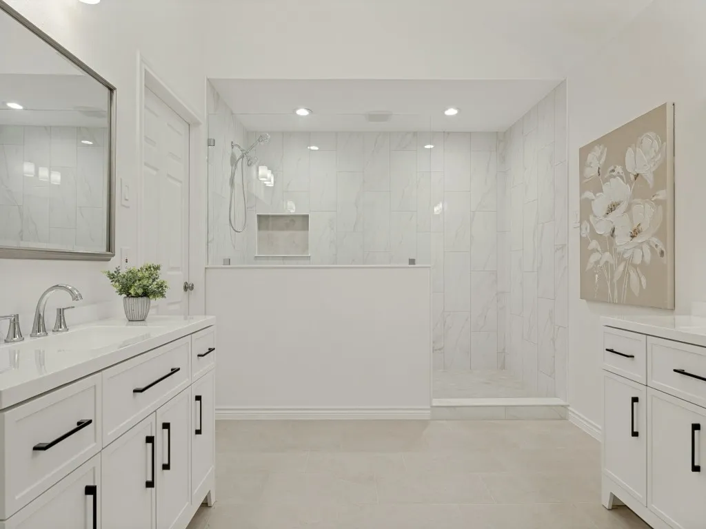 Gorgeous primary suite with massive shower and seamless glass enclosure.