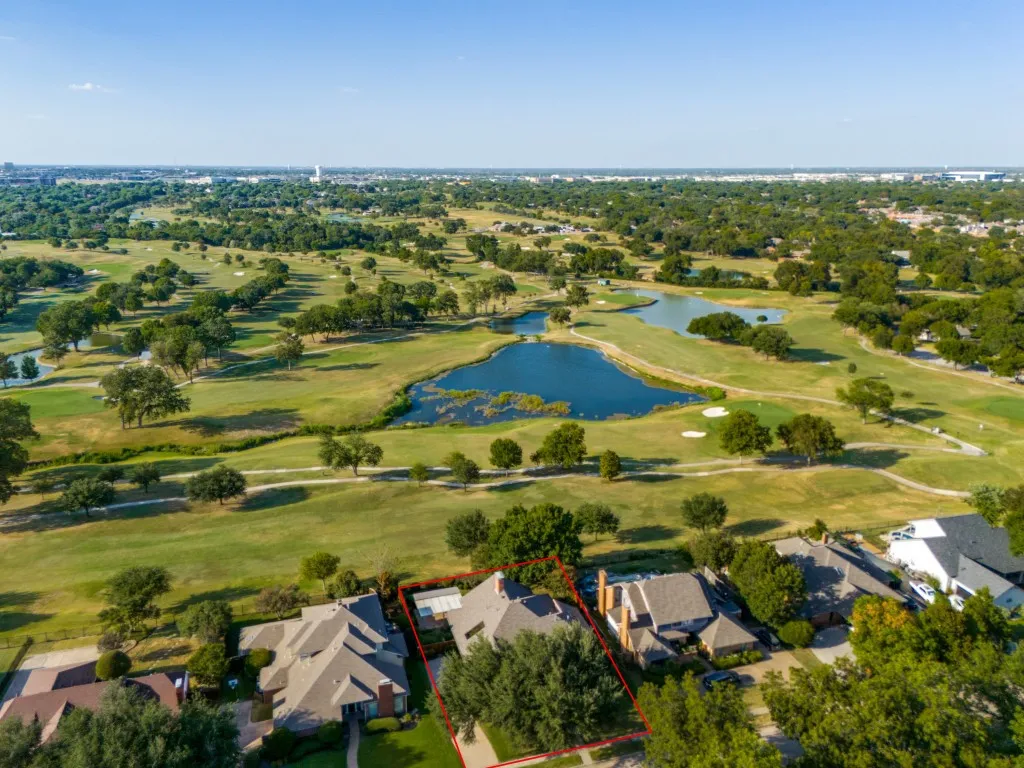 Breathtaking views of Sherrill Park Golf Course with lush landscaping and pond water feature.