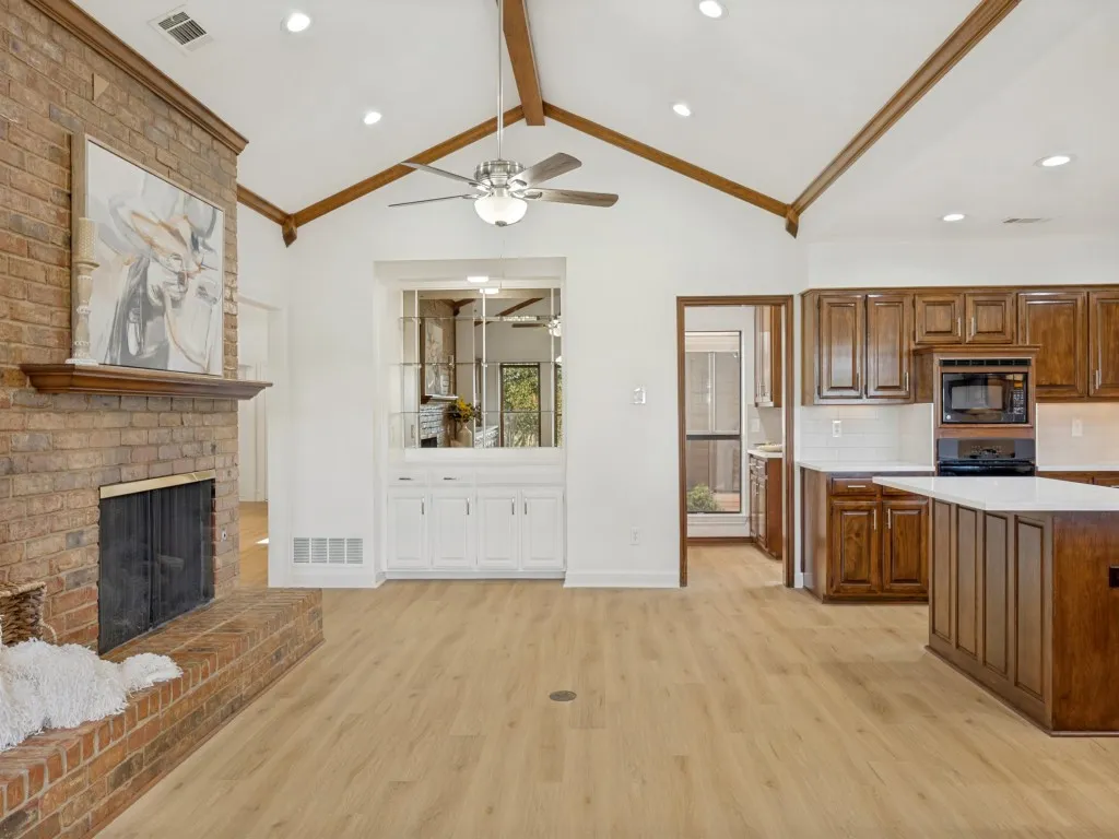 Another view of this cozy family room, kitchen, butlers pantry and built ins.