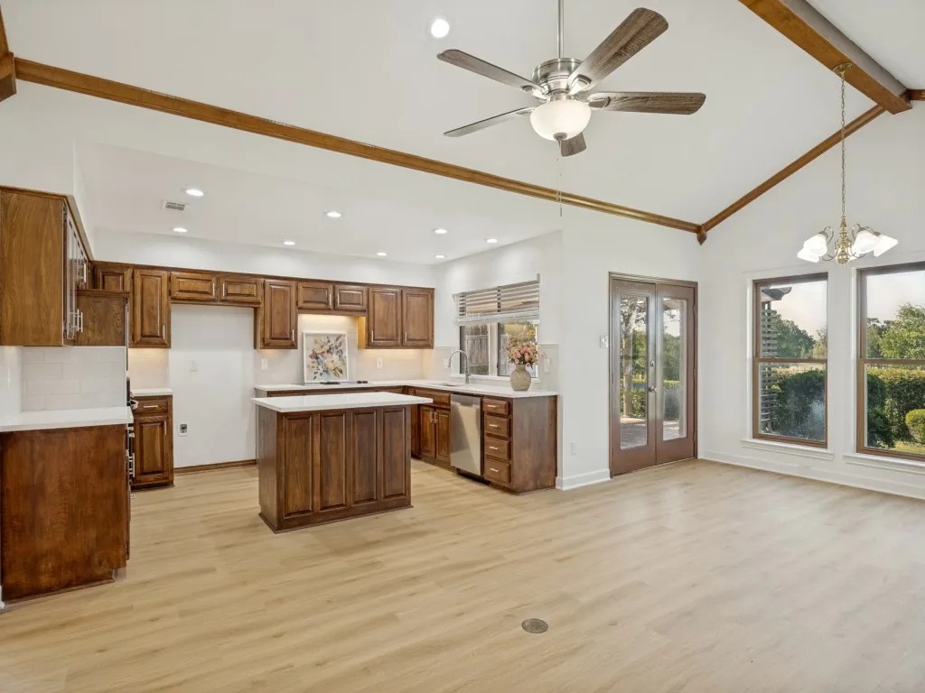Kitchen is open to the family room with custom mill work and vaulted ceilings.